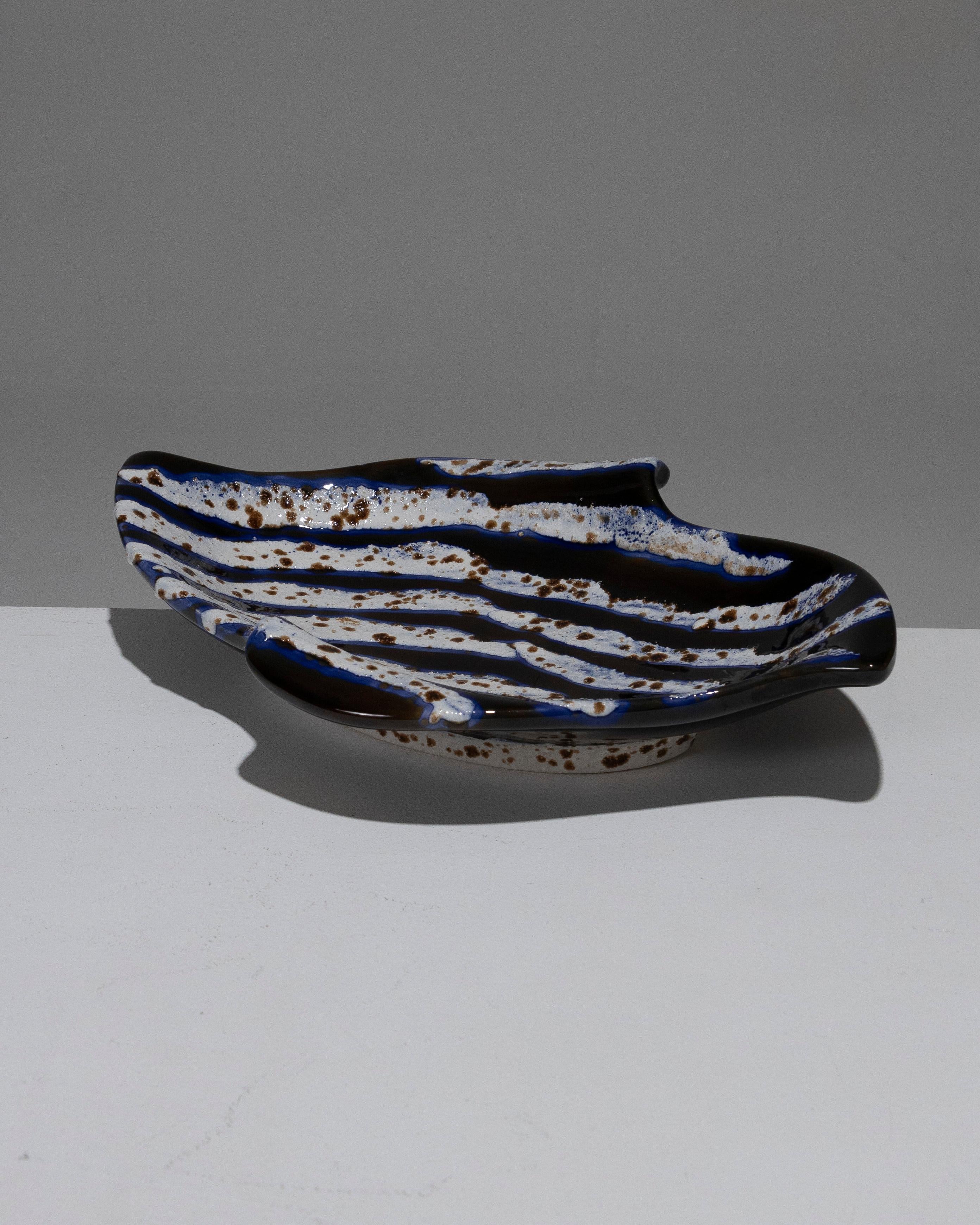 Large Diamond-Shaped Ceramic Bowl, crafted in the South of France in the 1950s. Symmetrical cut with upturned edges. The decor consists of white bands in textured, raised glaze, with irregular brown spots. These stripes are outlined in blue and