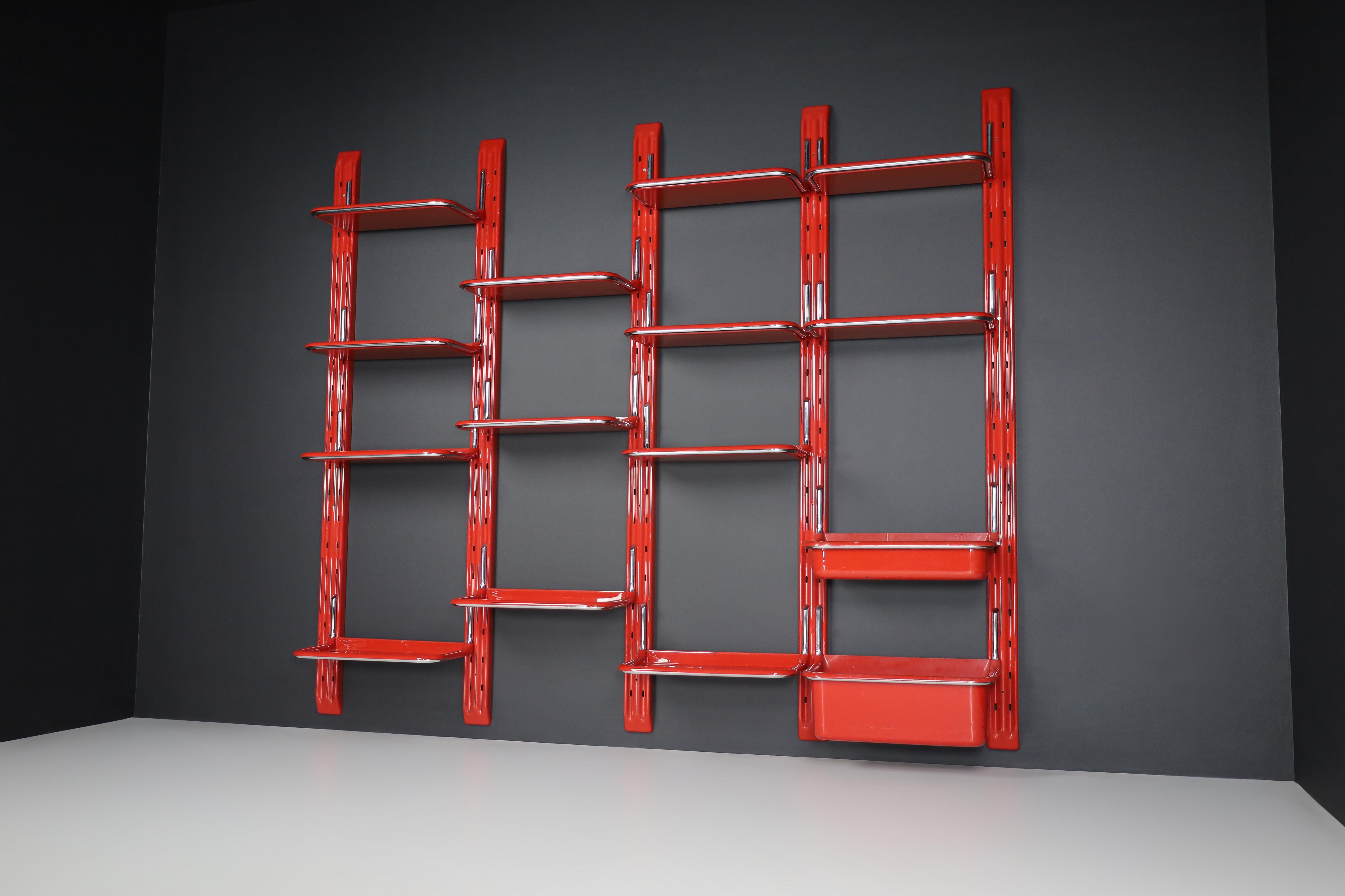 Large speedy bookcase by Alberto Rosselli for Saporiti, the 1970s

Alberto Rosselli for Saporiti, wall-unit ‘Speedy’, red plastic, chromed metal, Italy, the 1970s. This funky wall unit was designed by Alberto Rosselli circa 1970. The red colour of