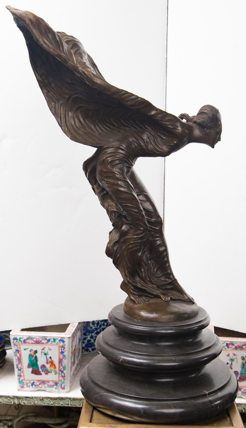 Raised on a black marble base, this statue, by Charles Sykes numbered 14/50. Signed C Sykes . This is the hood ornament mascot of Rolls Royce.

Charles Robinson Sykes (18 December 1875 – 6 June 1950)[1] was an English sculptor, best known for
