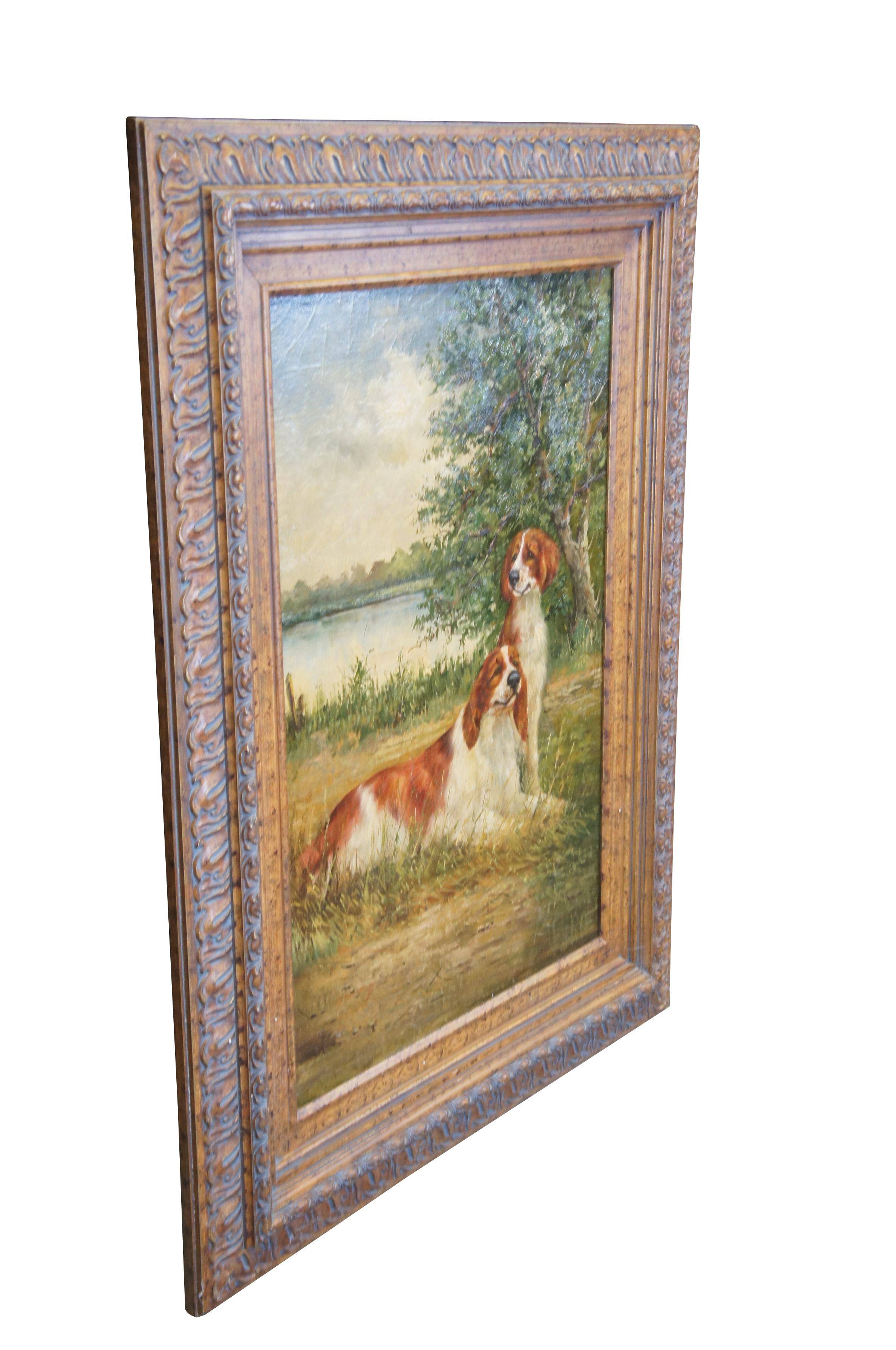 Large vintage landscape / dog oil painting on board depicting two red / brown and white Springer Spaniels seated in front of a large tree next to a lake .  Framed in gold floral acanthus style frame.

Dimensions:
35.5