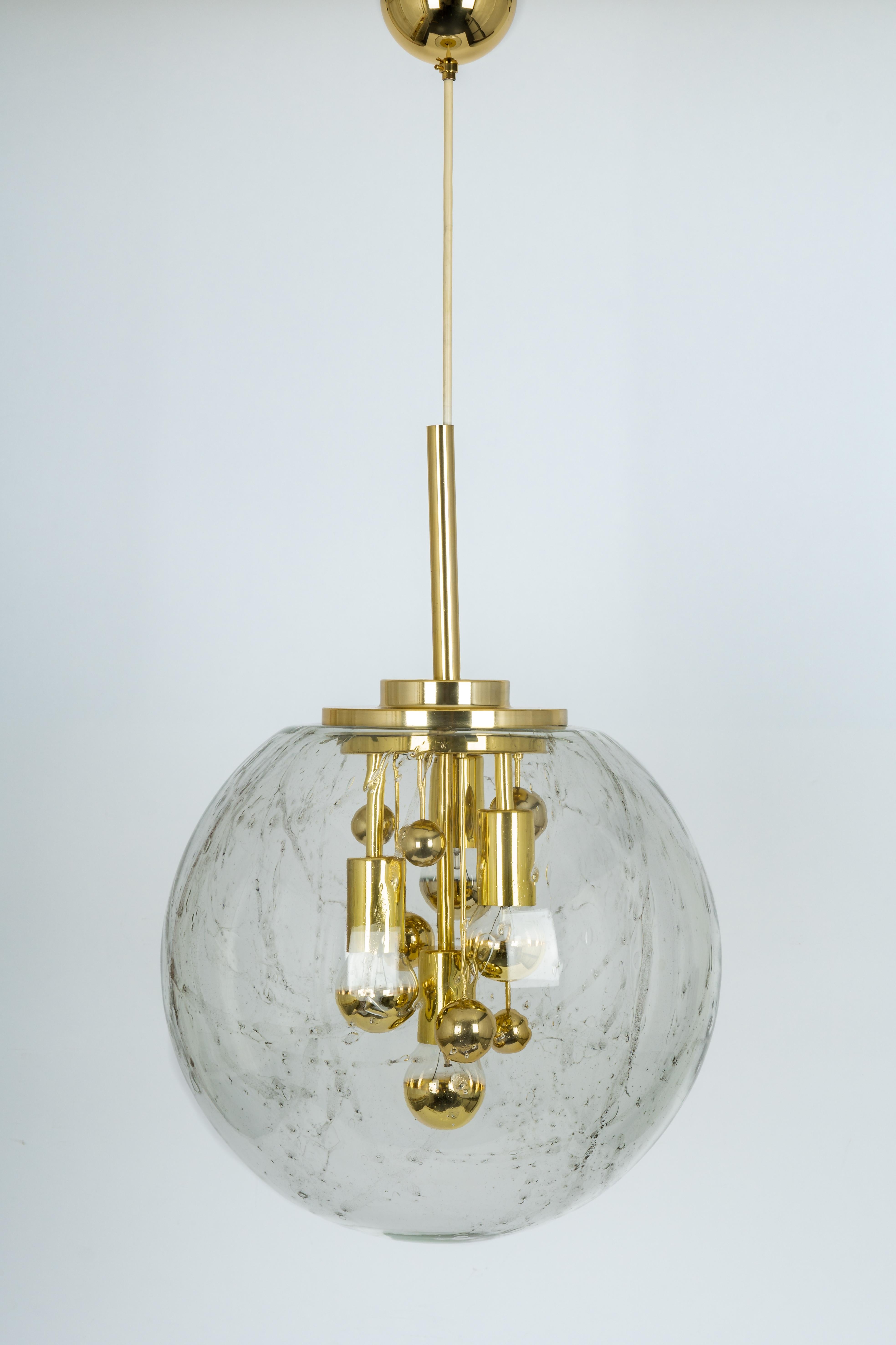 Doria ceiling light with large volcanic crystal glass dome on golden aluminum base. 
Between the four bulbs are currently six ball reflectors, the so-called. 