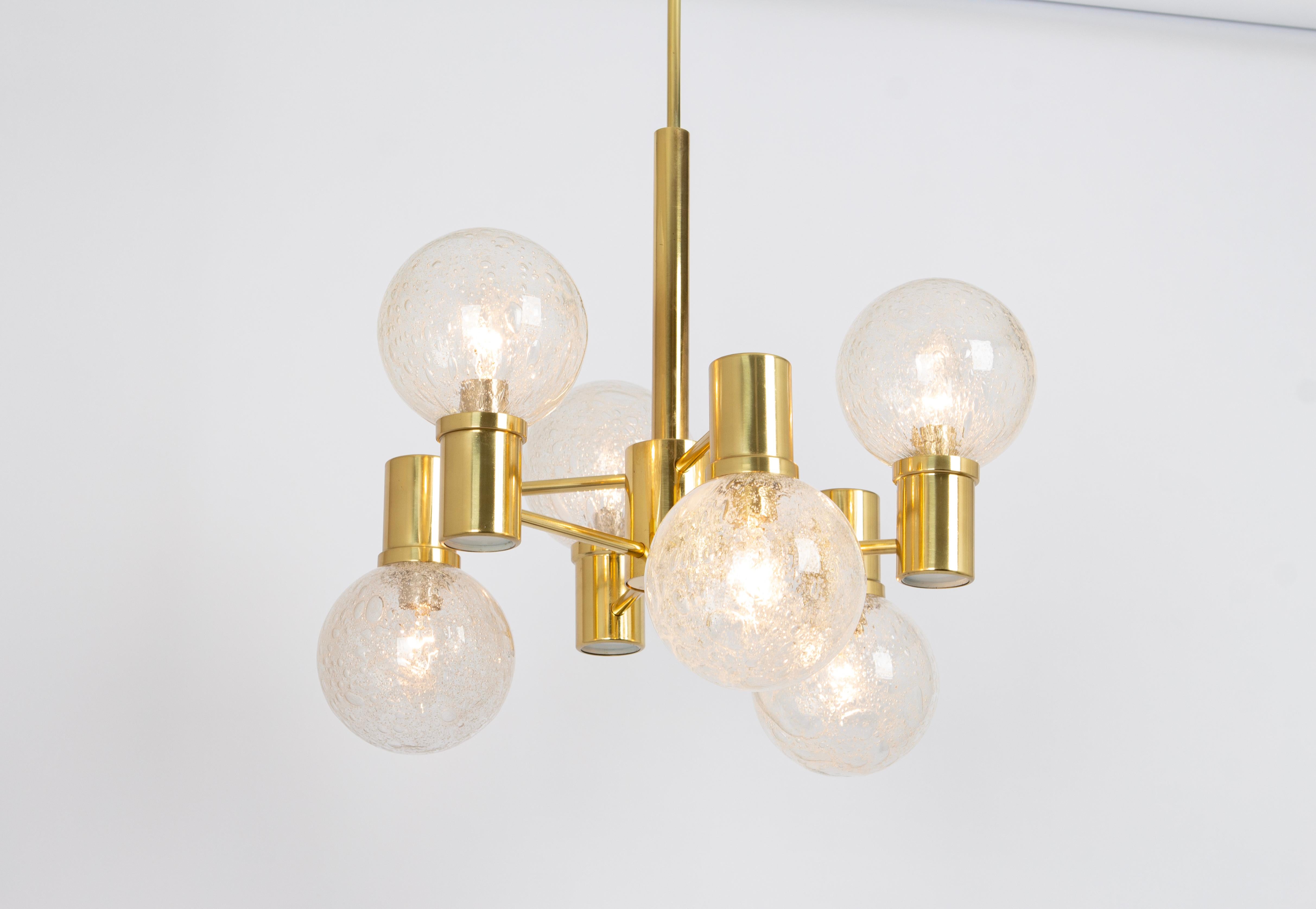 A midcentury pendant light made by Doria Leuchtern, manufactured in Germany, circa 1970-1979.
The pendant is composed of 6 blown glass balls attached to a brass frame.

Sockets: 6 x E14 small bulbs. (Up to 100 Watts)
Light bulbs are not included. It