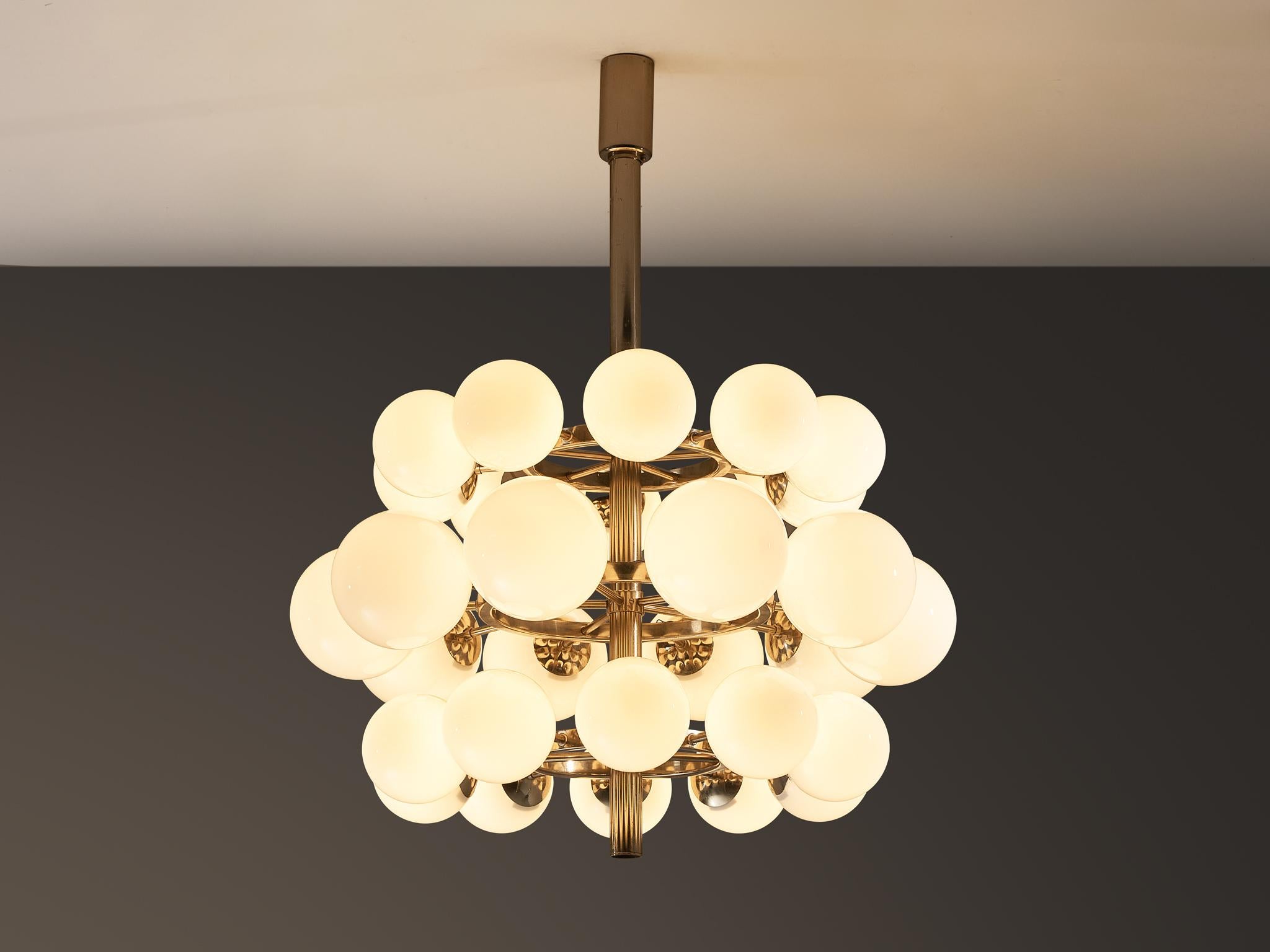 Sputnik chandelier, glass, nickel-plated steel, Europe, 1970s

This substantial triple-layered Sputnik chandelier features thirty glass globes arranged in a harmonious, radial design. The central metal fixture extends thirty sleek arms, each