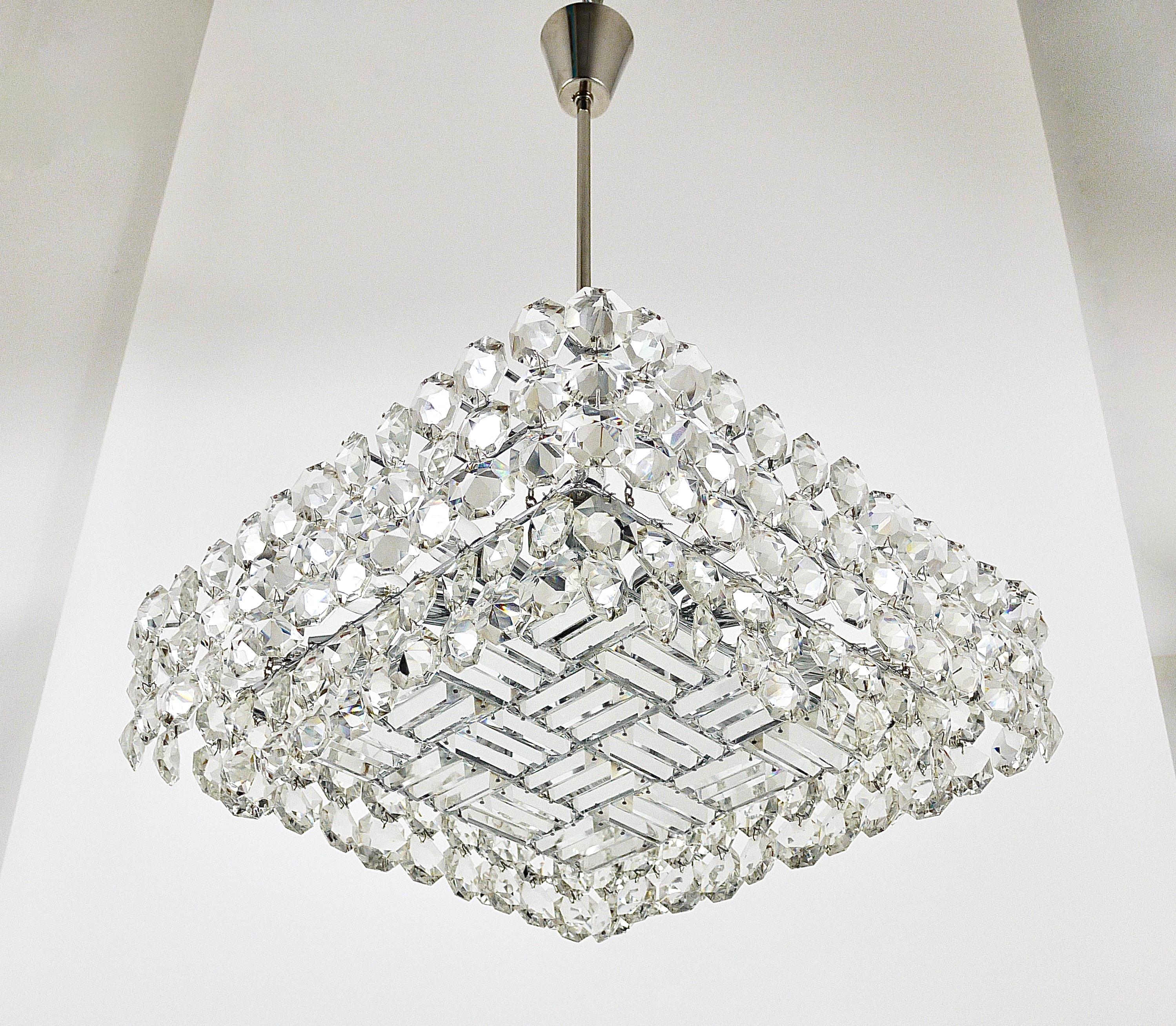 A beautiful, large brass crystal chandelier from the 1950s, manufactured by Bakalowits & Söhne, Vienna/Austria. Nickel-plated hardware, it has two tiers, fully covered by big, octagonal diamond-shaped faceted crystals. This chandelier has 16-light