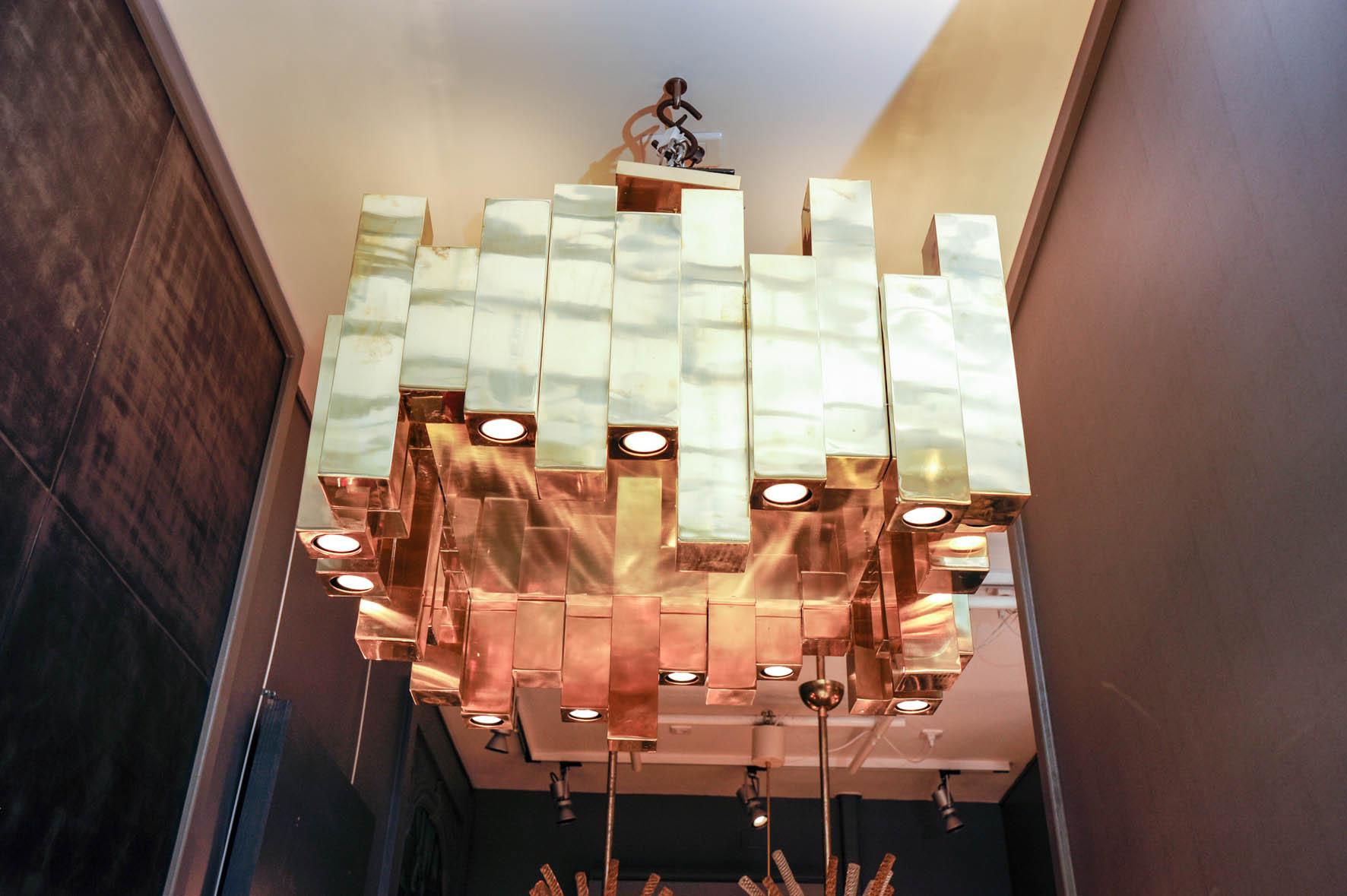 Large brass chandelier made of thirty six natural brass square unit assembled together.