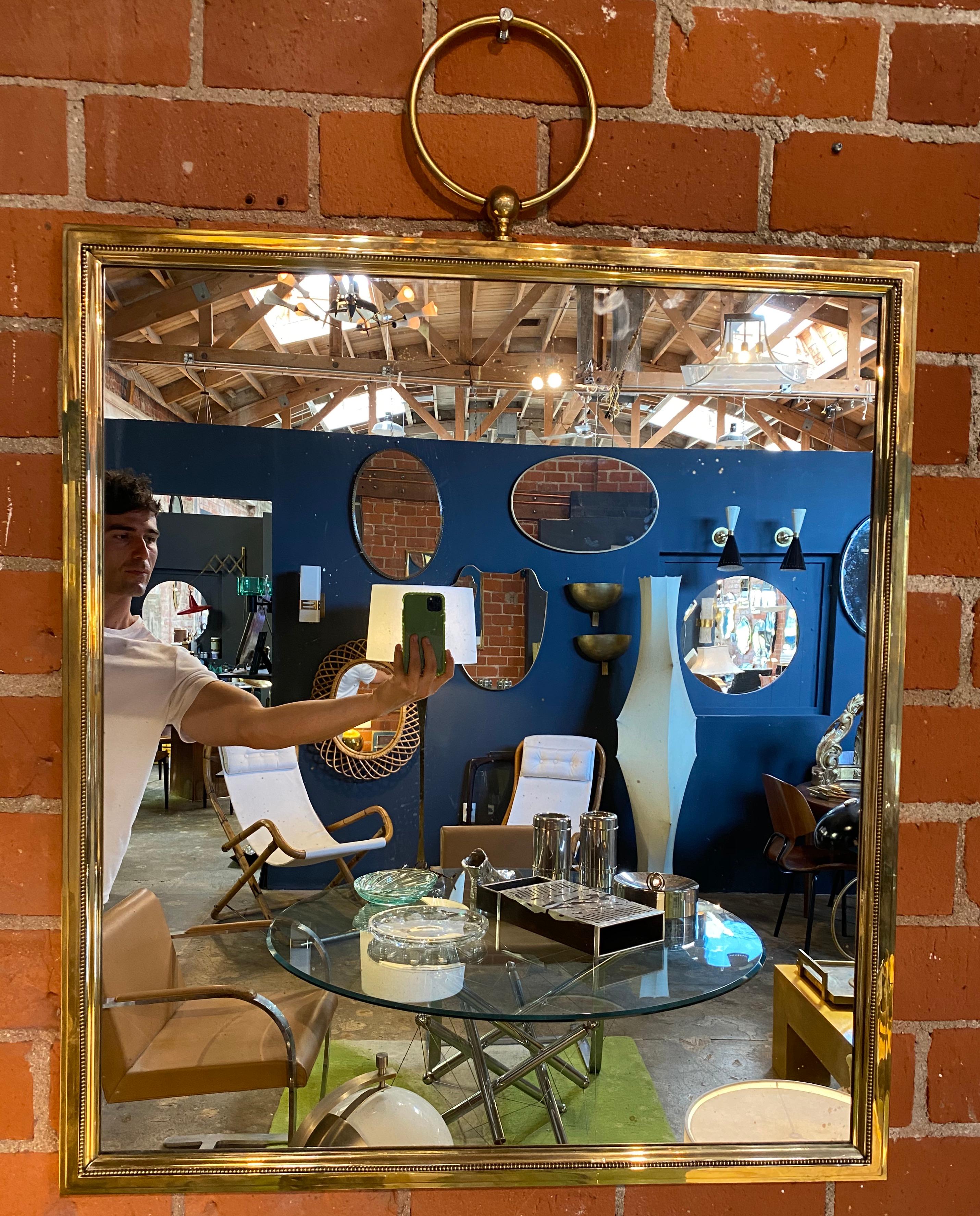 A large square mirror with a thick and-plated sheet sculptural brass frame in a good condition. The design of this 1960s mirror is Minimalist and ahead of its time.
Styles / Movements modern.