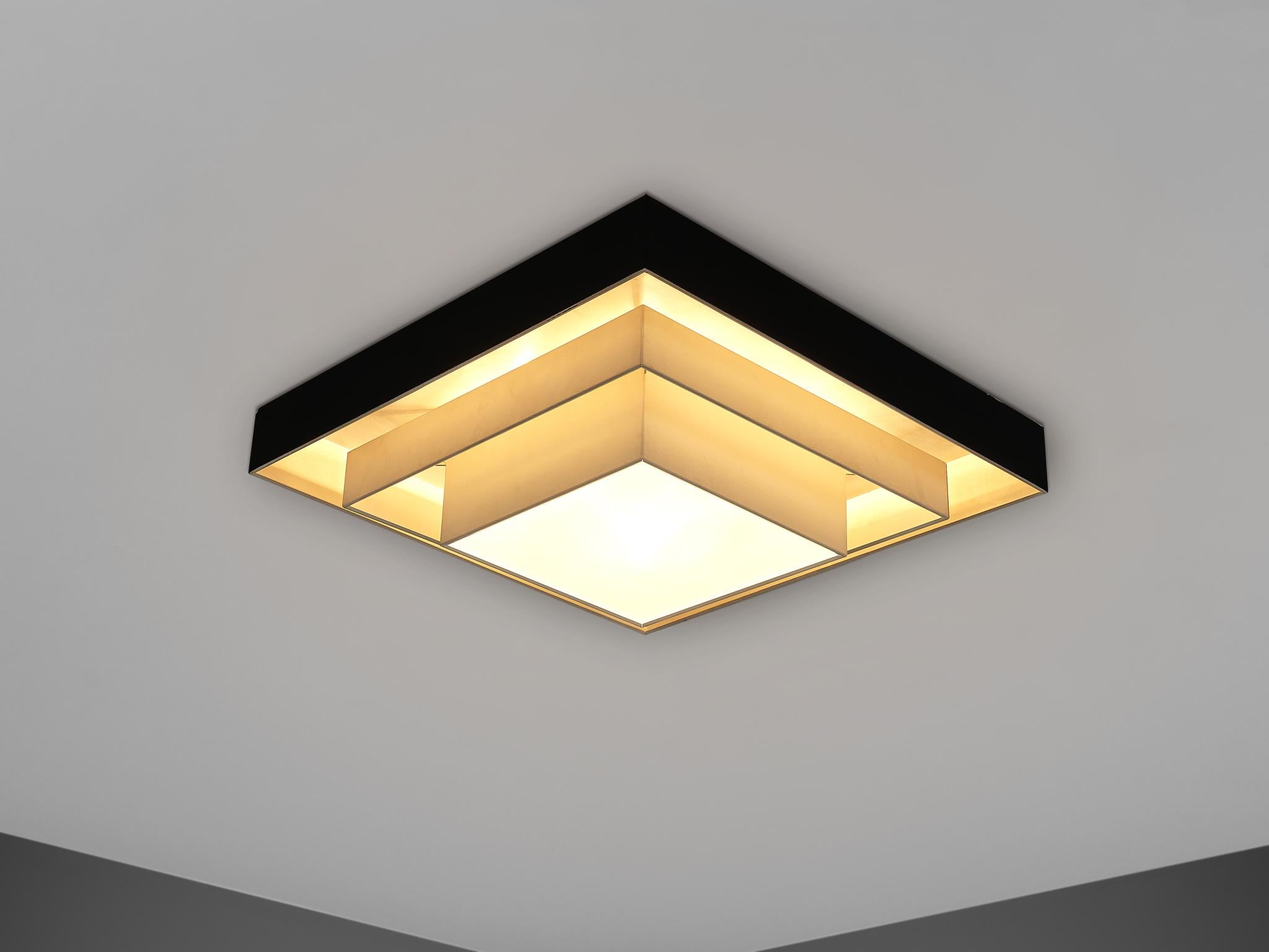 Ceiling light, metal and glass, Europe, 1970s.

Large square ceiling lamp in black and off-white lacquer. Executed with an opal white glass shade, which provides a pleasant diffuse light. The light is very solid and well made, and of a significant