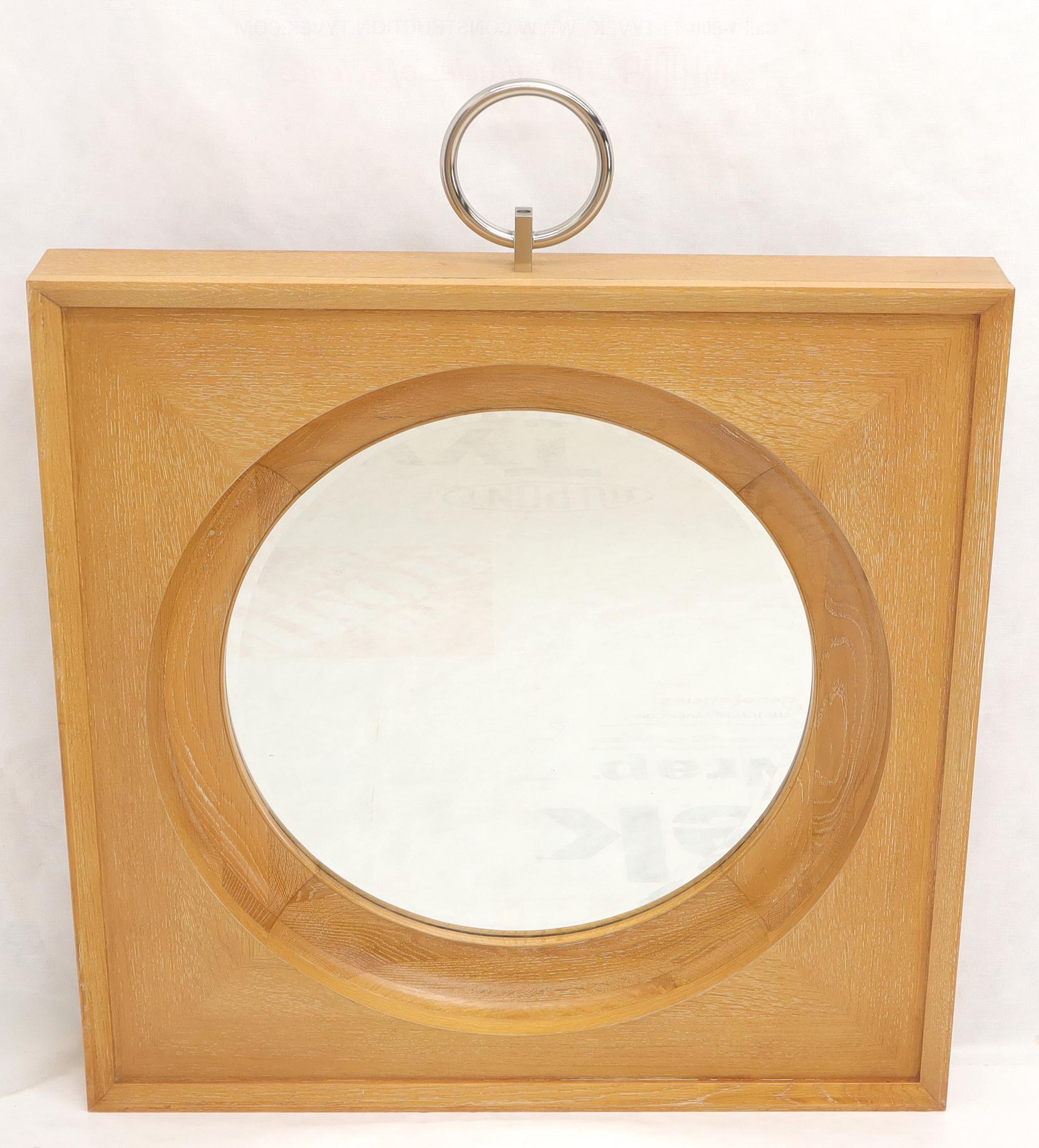 round mirror in square frame