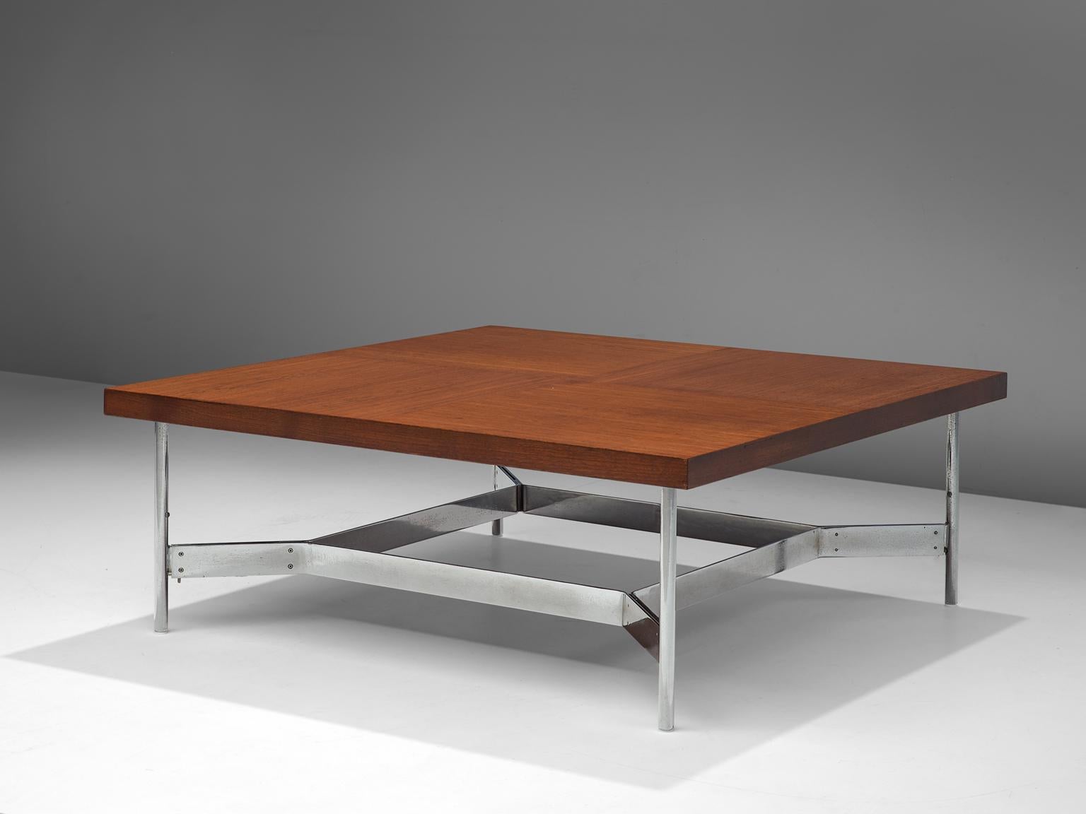 Coffee table, in teak and steel, Germany, 1960s.

Square coffee table with large square top in teak. The frame consist of four tubular steel legs. Steel straps form a cross-connection between the four legs. The grain on the top shows again four