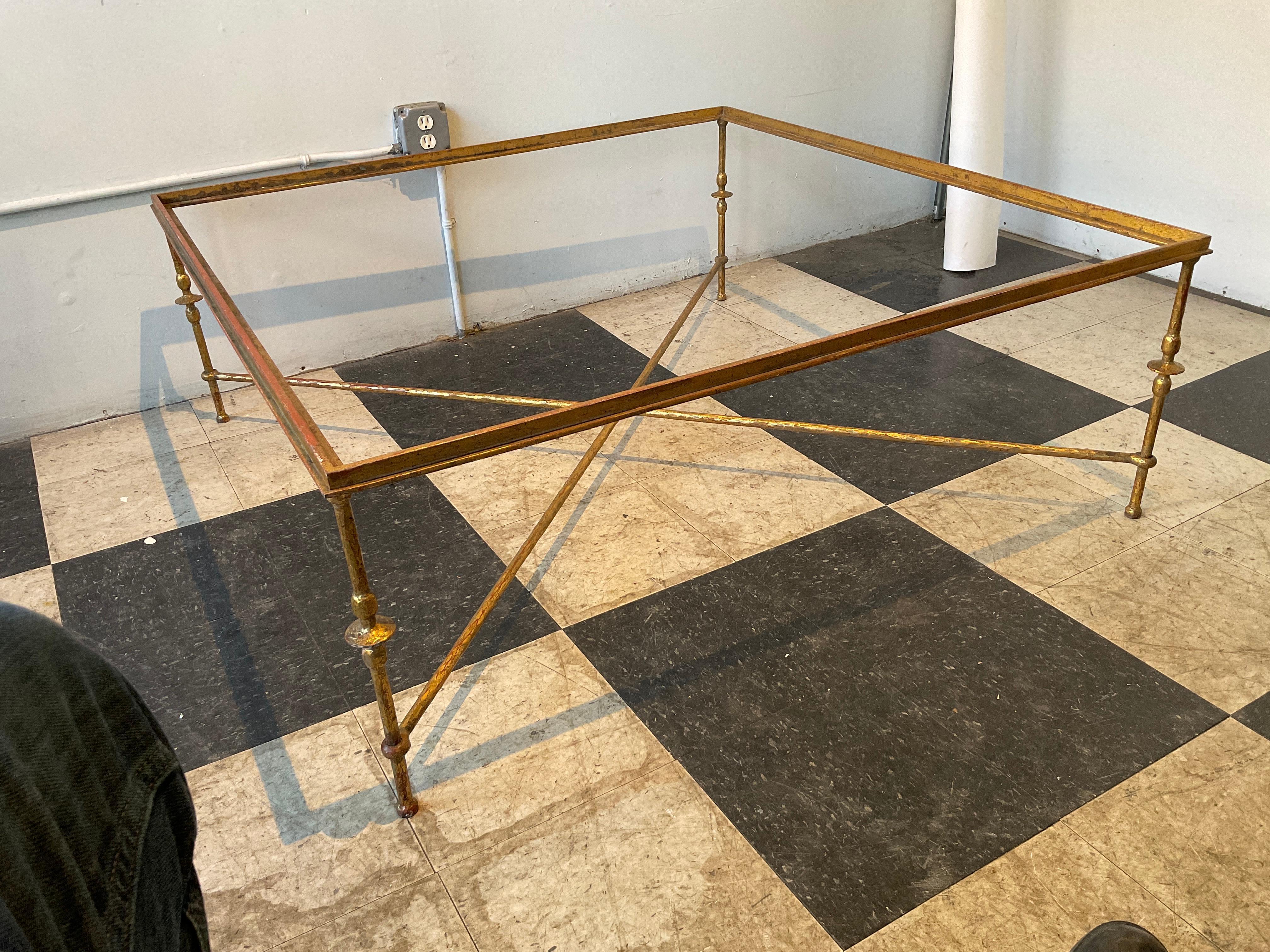 Large Giacometti style gilt iron coffee table base. There is no glass!