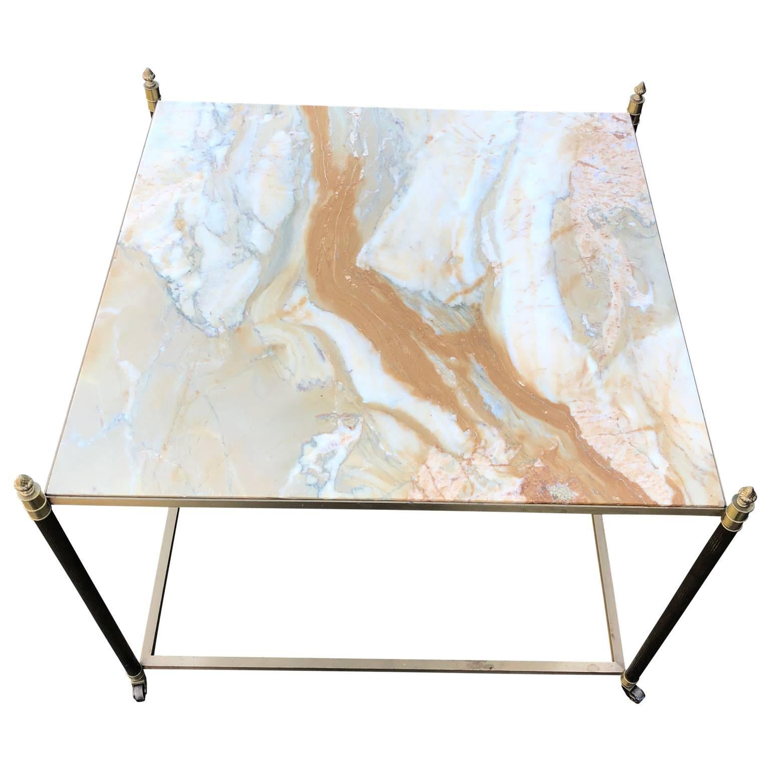 Large square onyx and brass coffee, sofa or cocktail table by Maison Bagués

$125 flat rate front door delivery includes Washington DC metro, Baltimore and Philadelphia.
  