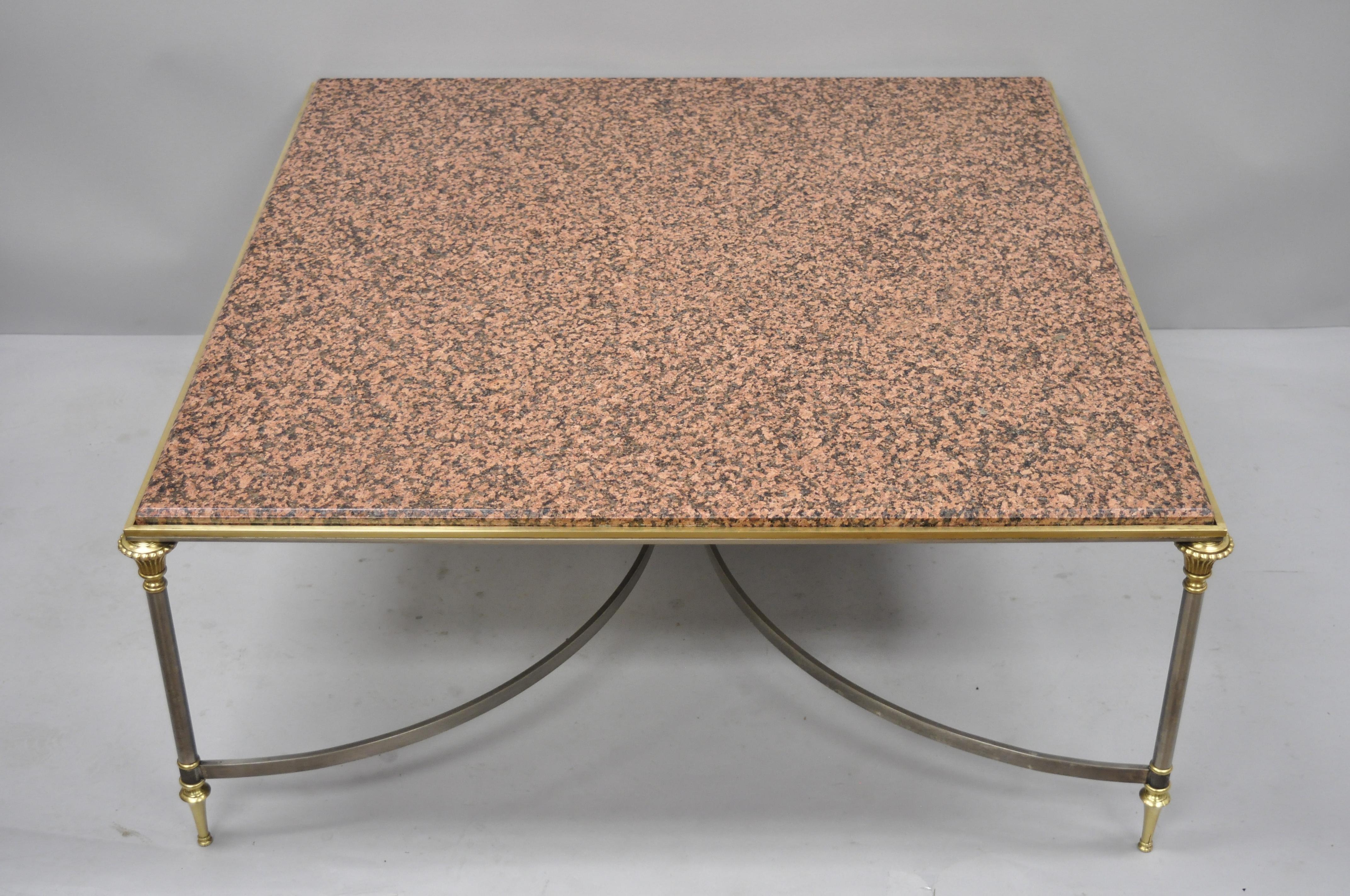 Large square pink marble top steel and brass coffee table attributed to Maison Jansen. Item features inset pink marble top, large steel frame, brass accents, signed 