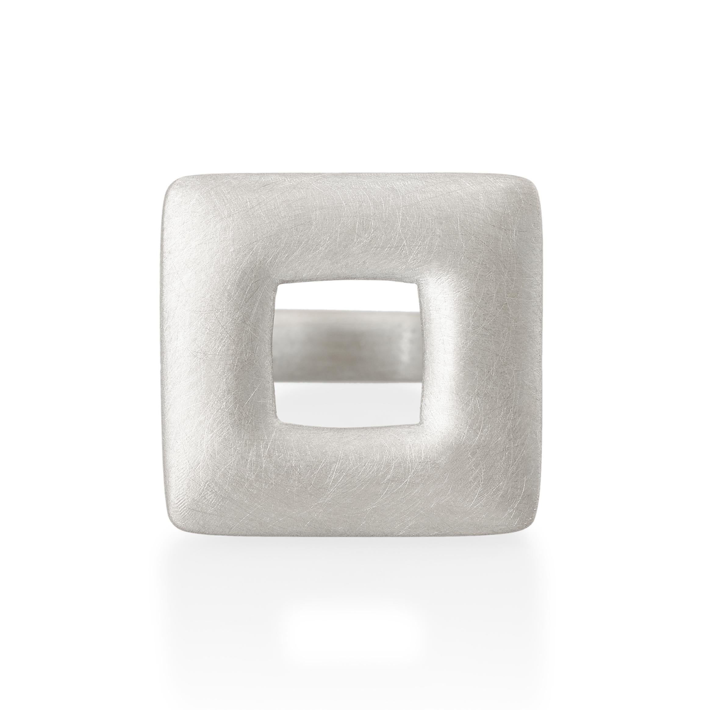 Hand carved large square ring with a square window in the centre.
Ref: S18001

24mm square  
Sterling silver

Cadby & Co are a family business that specialise in reusing & up cycling old cut diamonds and fine gem stones. Deborah Cadby’s designs and