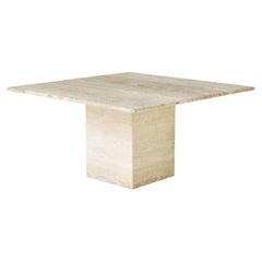 Large square travertine dining table dating from the 1960s.