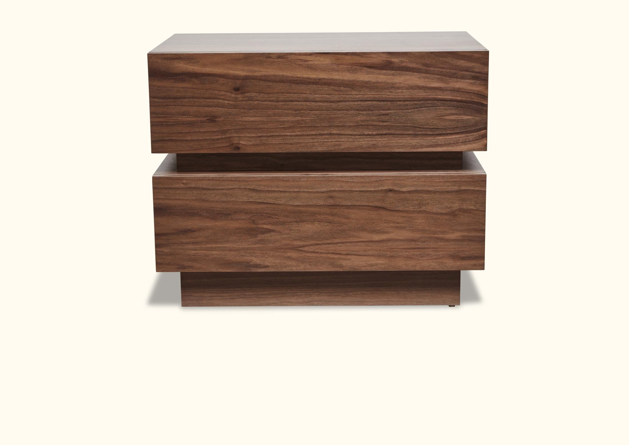 The stacked box nightstand is a bedside table with two drawers that is available in either American walnut or white oak. Available in two sizes.

Shown here in natural walnut.