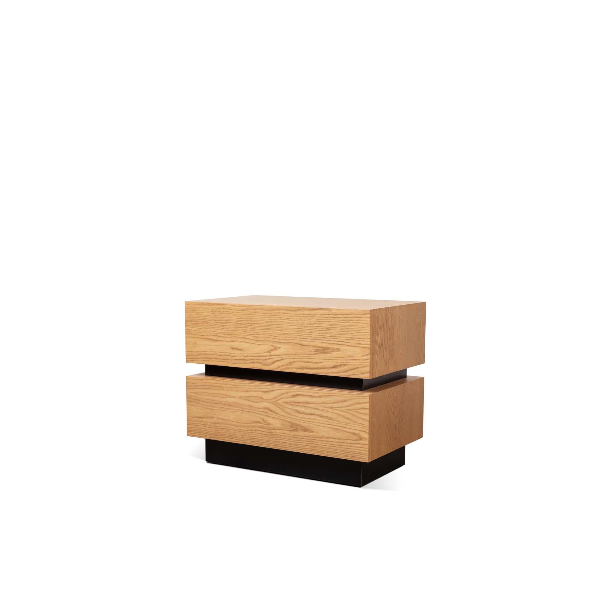 The stacked box nightstand with Metal Inset is a bedside table with two drawers that is available in either American walnut, or white oak and features a metal inset detail between the drawers. Available in two sizes. 

The Lawson-Fenning Collection