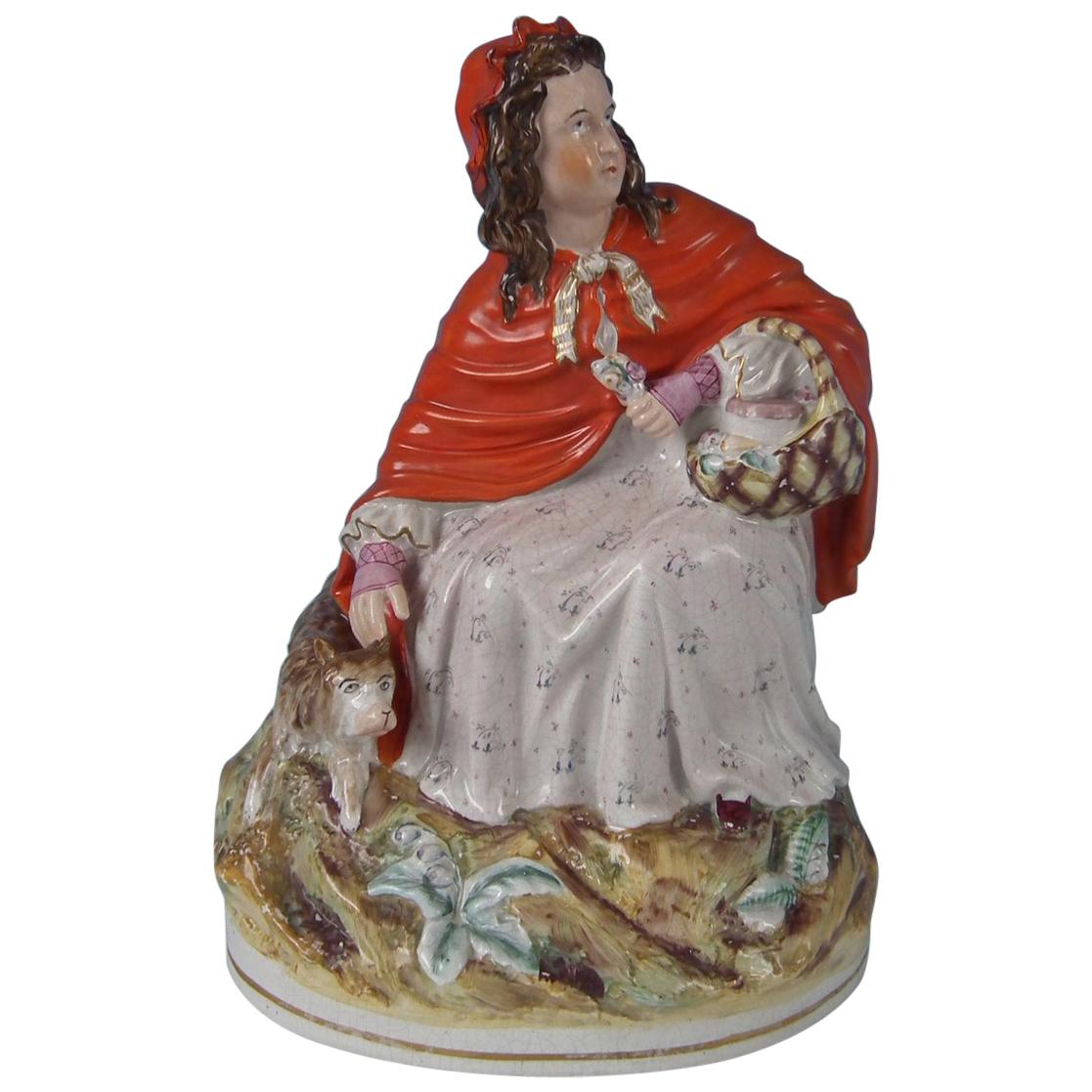 Grande figurine du Staffordshire représentant le chaperon rouge et le loup