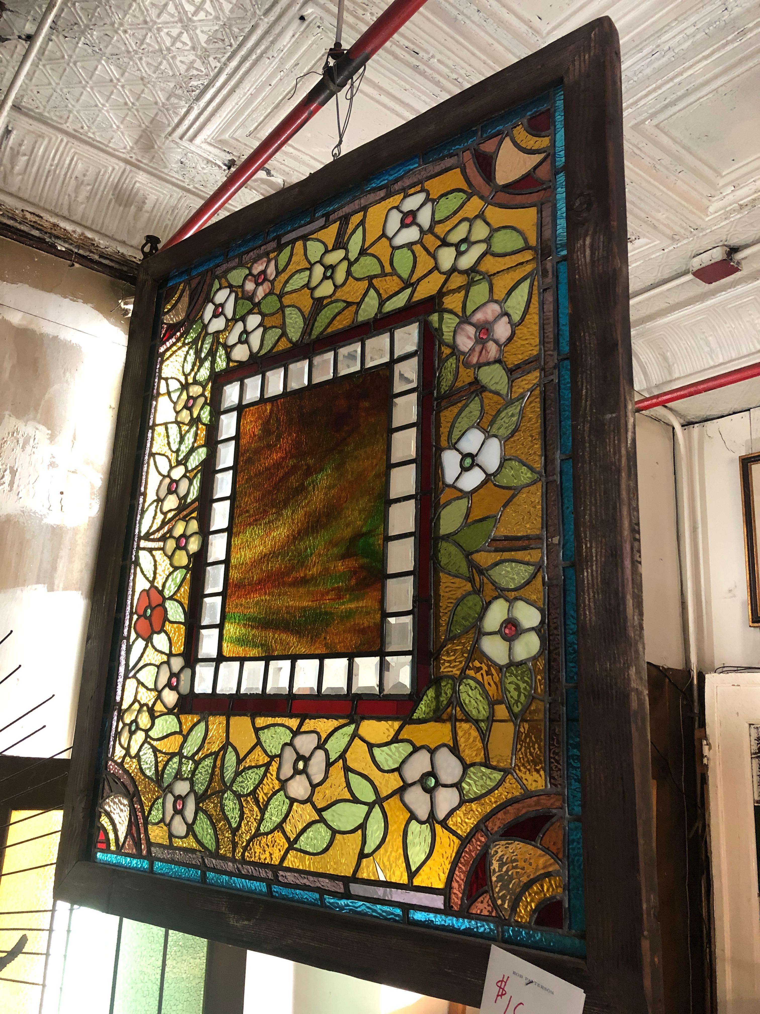 American made stained glass window with masterful coloring and led work. Deep colors of blue and red with amber.
Currently housed in a temporary wooden frame - the overall dimensions are for the stained glass and the frame.
Located in NY