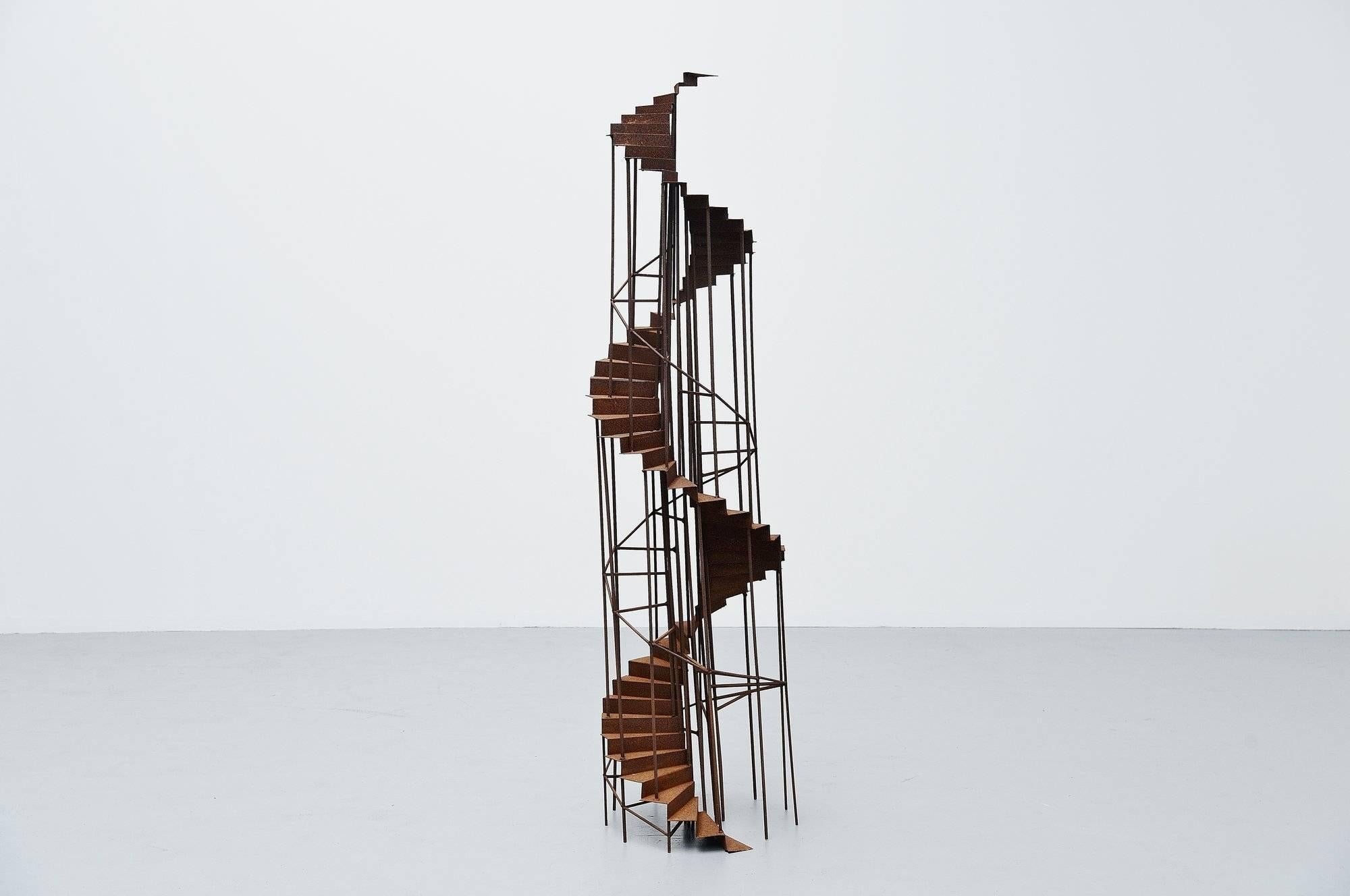 Very nice large and decorative staircase sculpture in the manner of Theo Niermeijer and MC Escher, Holland, 1970. This in or outdoor sculpture was made or solid metal, oxidized. This is very nice large in size and would look highly decorative in a