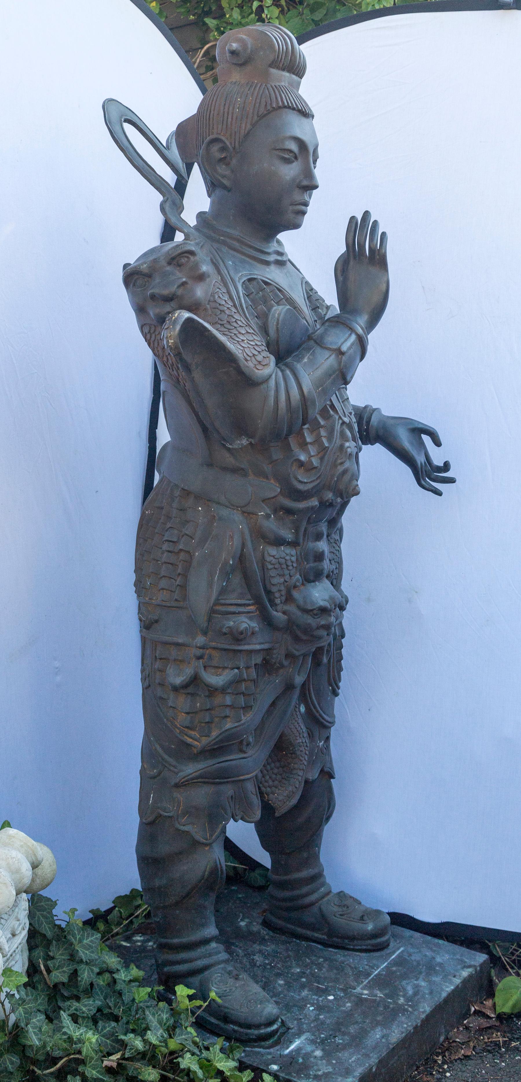 Extremely well cast bronze, which leads us to believe it was crafted in Italy, and not in China. Note the animal head masks on his shoulders, his armor, more animal head masks below his chest, and his boots.
He stands 71 inches tall, and from