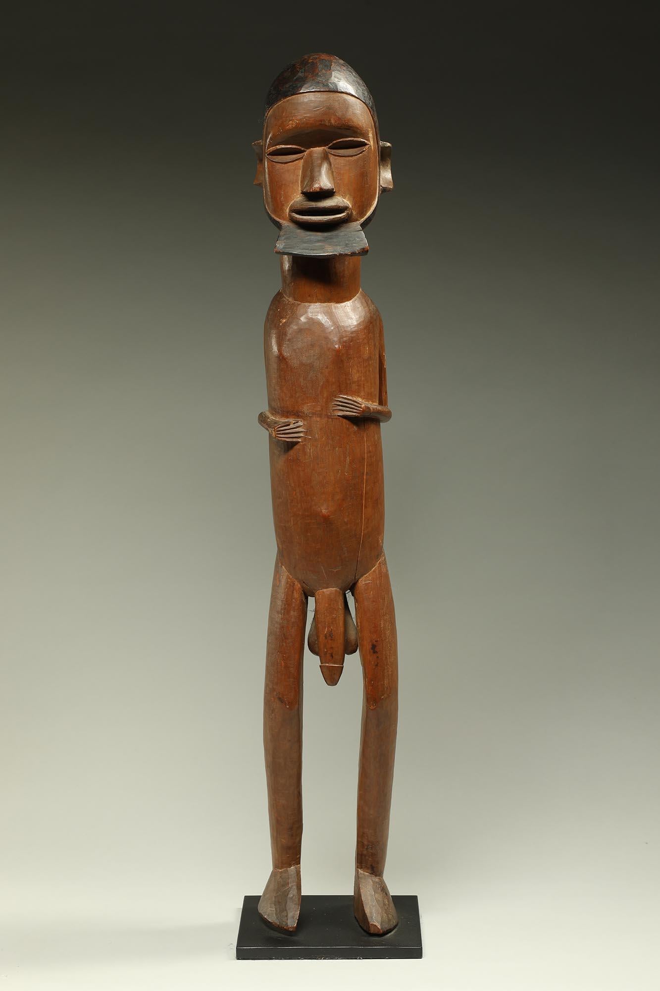 Early large standing male Teke figure with classic darkened beard and hair.  Small stylized arms and hands on chest.
ex- CA collection, acquired in 1998 from San Francisco Gallery.
28 1/2 inches high, on custom metal stand.
Created mid 20th century