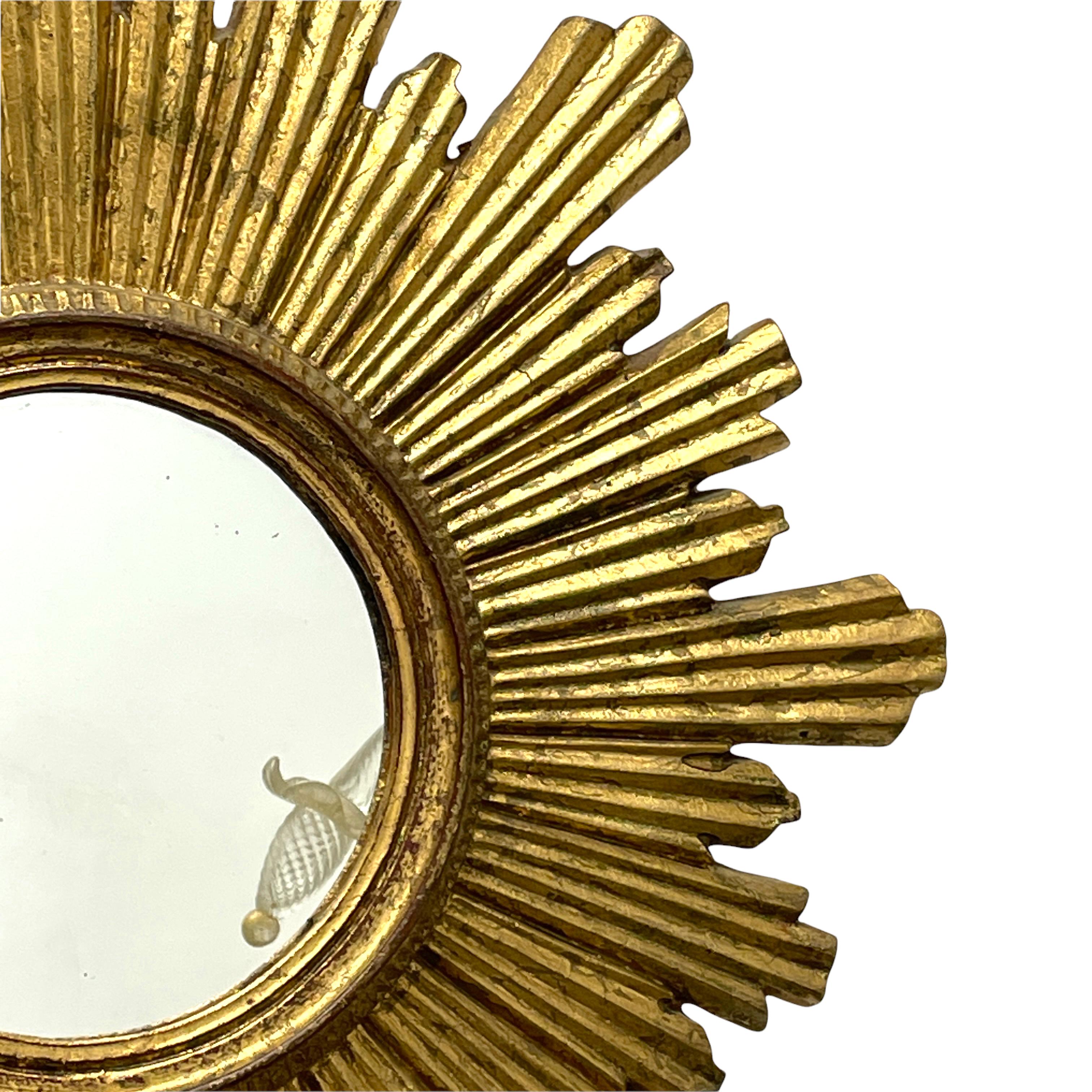 German Large Starburst Sunburst Gilded Wood and Stucco Mirror, circa 1930s