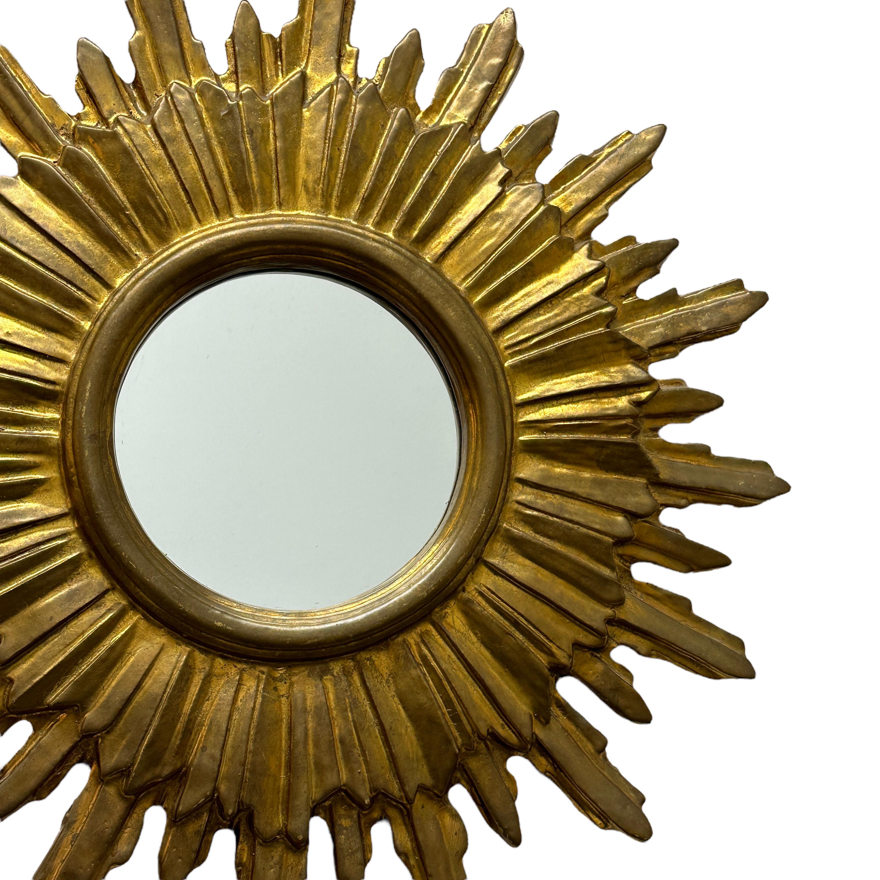 German Large Starburst Sunburst Gilded Wood and Stucco Mirror, circa 1930s