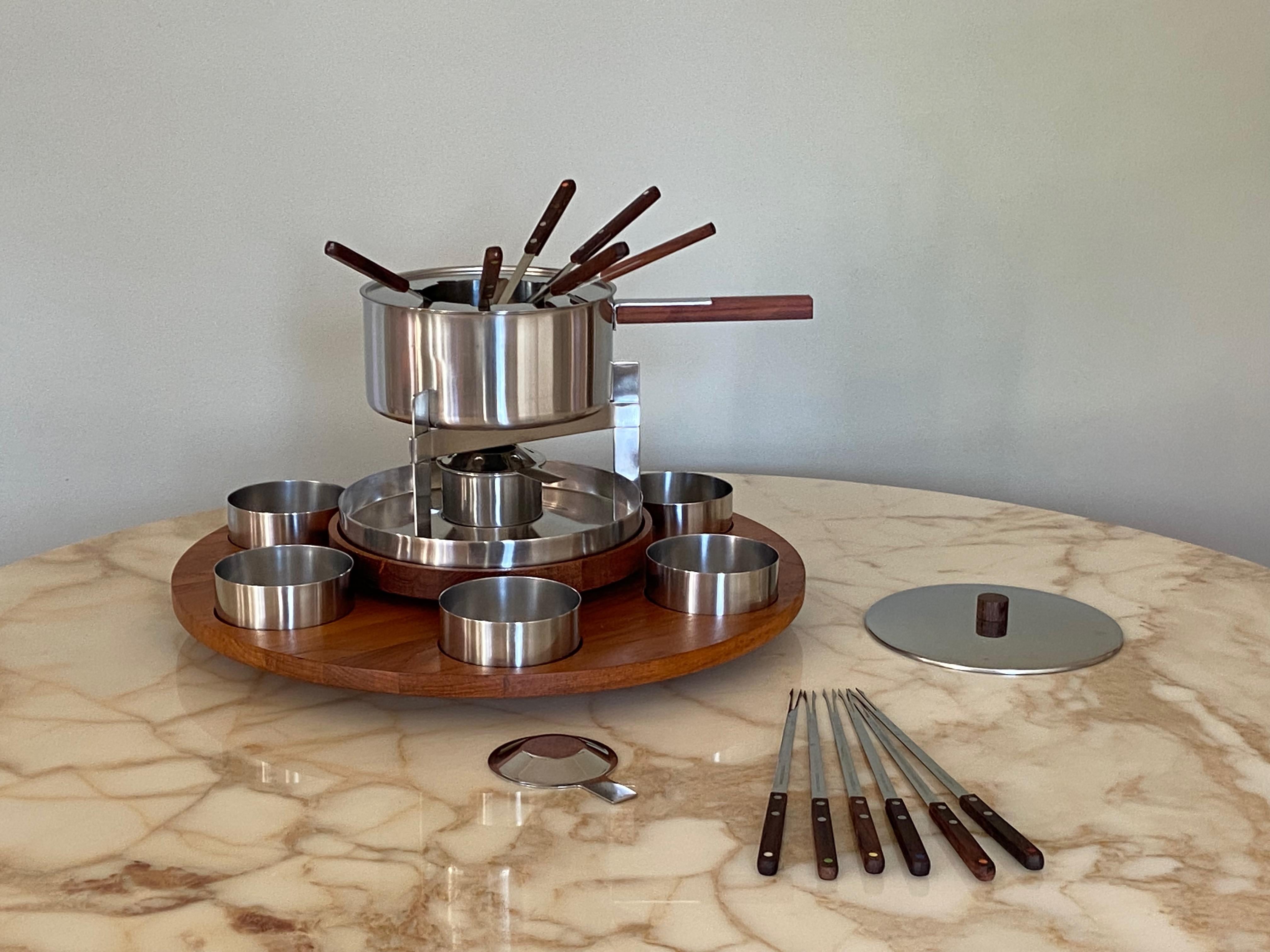 Teak and stainless steel fondue set with wood handle and Stelton Teak Lazy Susan. Designed by Danish mid-century designer Peter Homblad (stepson from Arne Jacobsen) for Stelton, Made in Denamrk. This set comes with 2 Sets original Stelton Fondue
