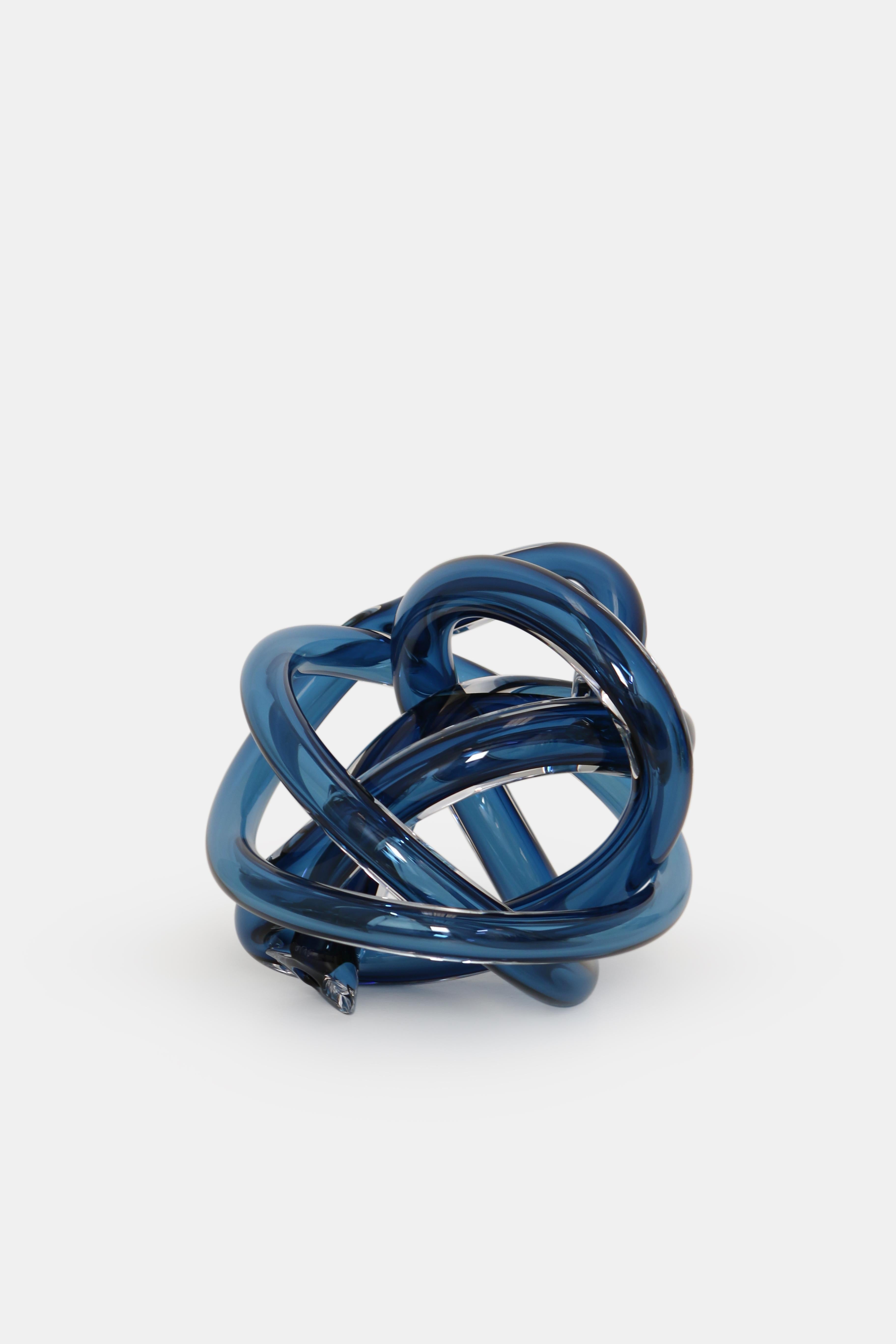Large steel blue wrap sculpture by SkLO
Dimensions: D 25 cm
Materials: glass
Available in other size and colors.

SkLO large wrap objects are a larger version of the classic SkLO Wrap, a wound length of handblown Czech glass tube. Each SkLO