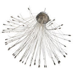 Grande lampadario in acciaio
