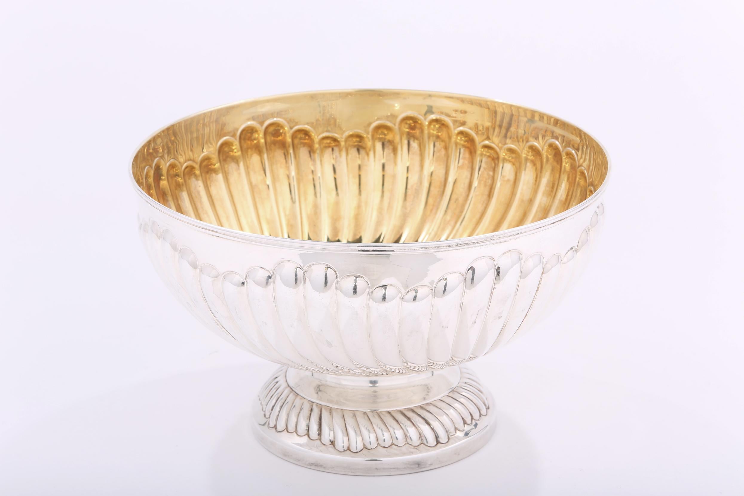 Large Italian sterling silver footed centerpiece bowl with gold washed interior and ribbed design. The bowl is in great condition. Maker's mark 800 silver .  Minor wear consistent with age / use. The bowl stands about 7.3 inches high X 12 inches