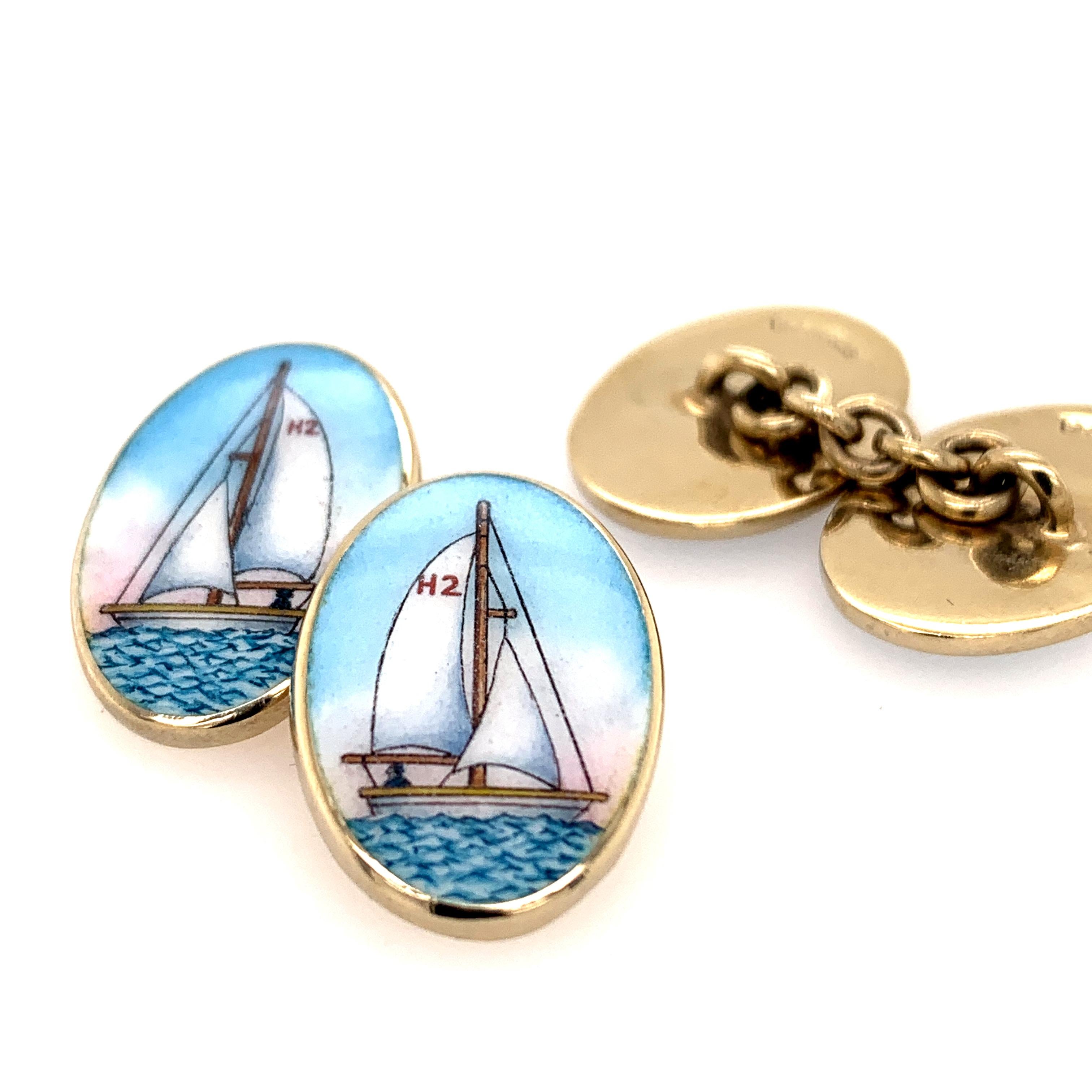 Large oval double-sided cufflinks.  Solid gauge sterling silver with enameled sailboats on each side.  3/4