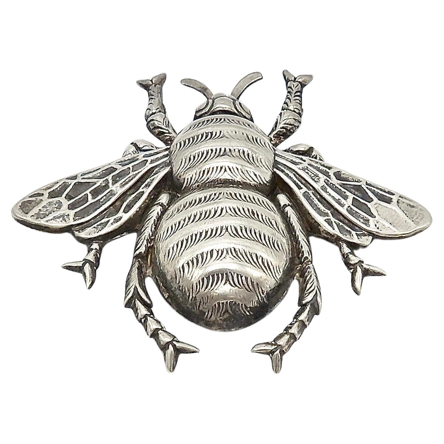 This large stamped sterling silver bumblebee brooch by Fletch & Co., also known as Danecraft, is an iconic image of our pollinating friend the bumblebee. The brooch has beautiful details to the wings and a plump body with lifelike engravings to