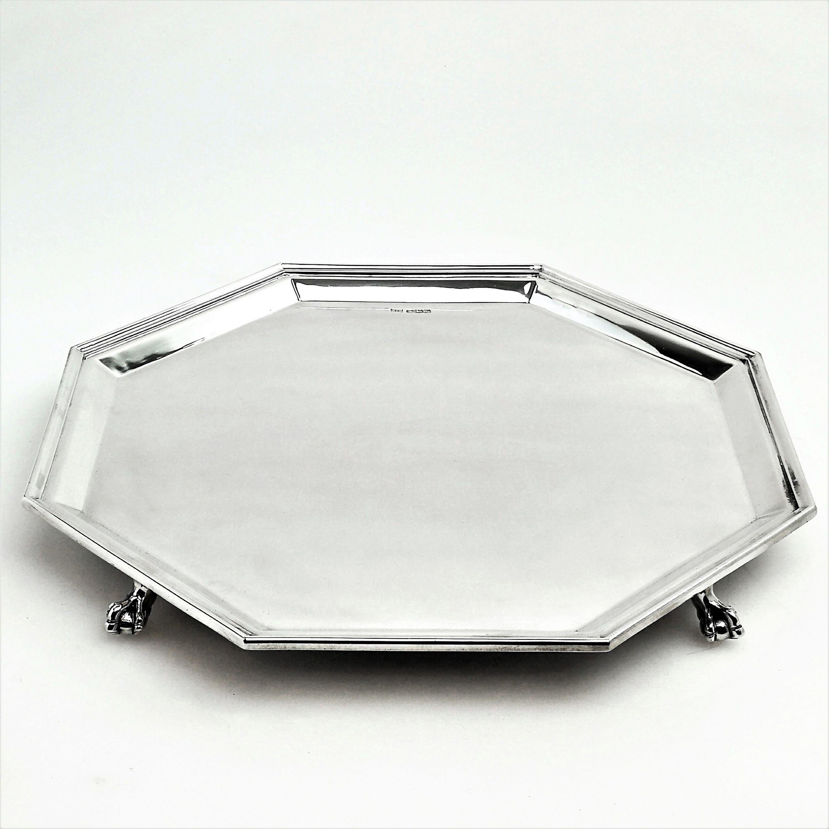 An magnificent solid Silver Salver in a stylish octagonal shape. This Tray has a highly polished finish and stands on ball and claw feet.
 
 Made in 1948 in Sheffield by Walker & Hall.
 
Approx. Weight - 51.5oz / 6104g
Approx. Width - 14.5 inches
 
