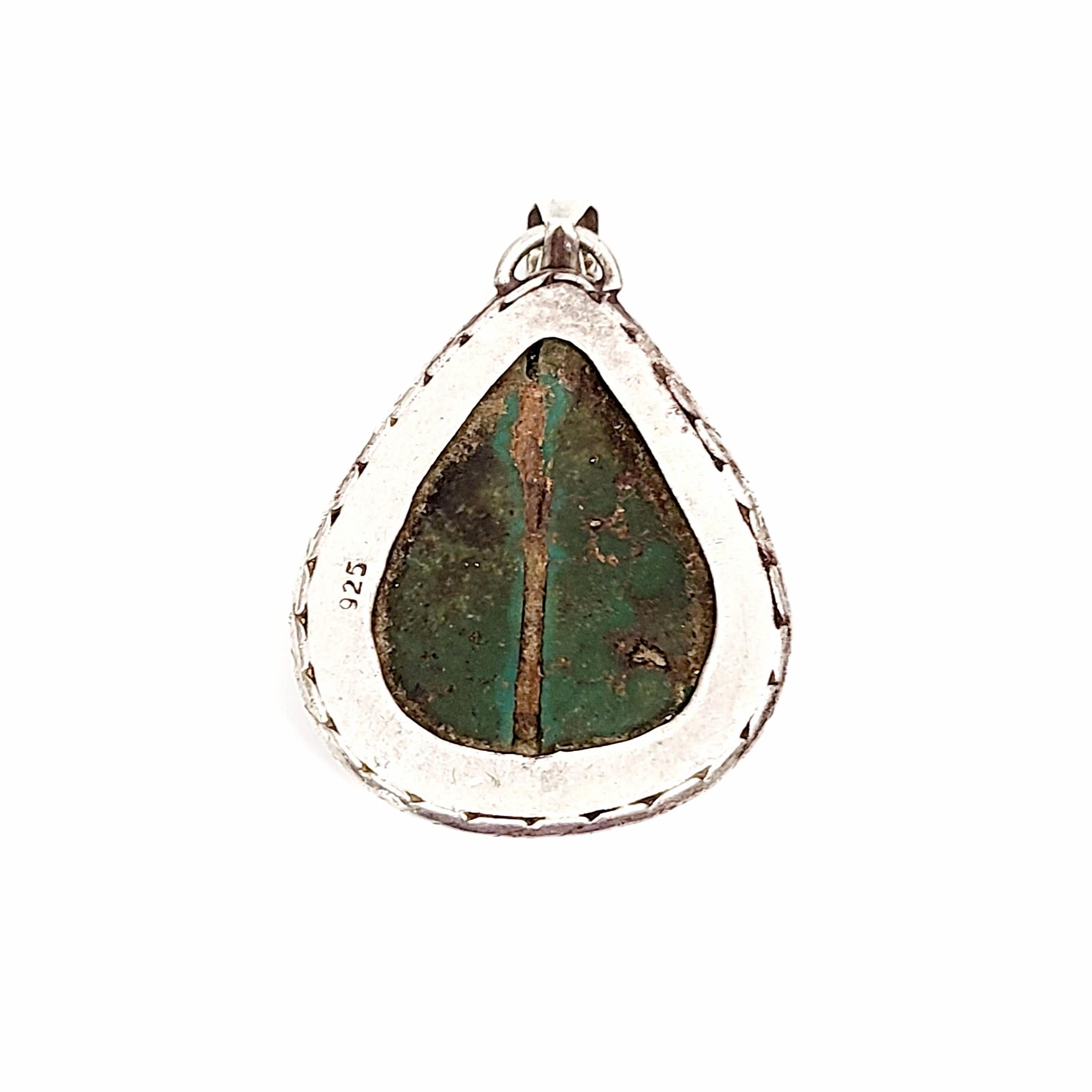 Sterling silver and pilot mountain turquoise large pendant.

A large, beautifully matrixed pilot mountain turquoise stone is bezel set in a twisted frame.

Measures approx 1 3/4