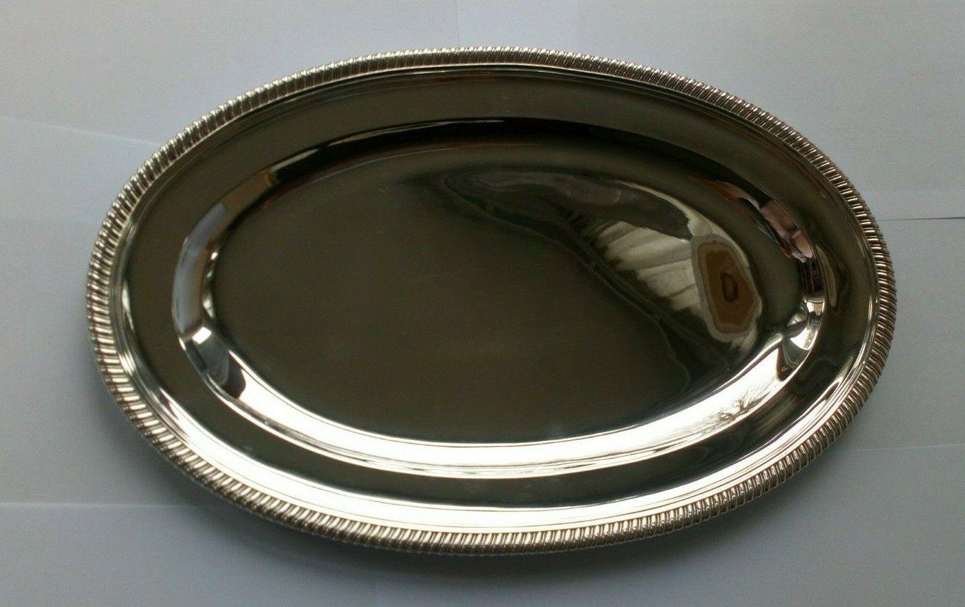 Large Sterling Silver Tray by Goldsmiths & Silversmiths Co Ltd from 1933

In good condition, this tray is oval with a plain body and styled borders.

Hallmarked: Made by Goldsmiths & Silversmiths Co Ltd in 112 Regent’s Street, London in 1933. The