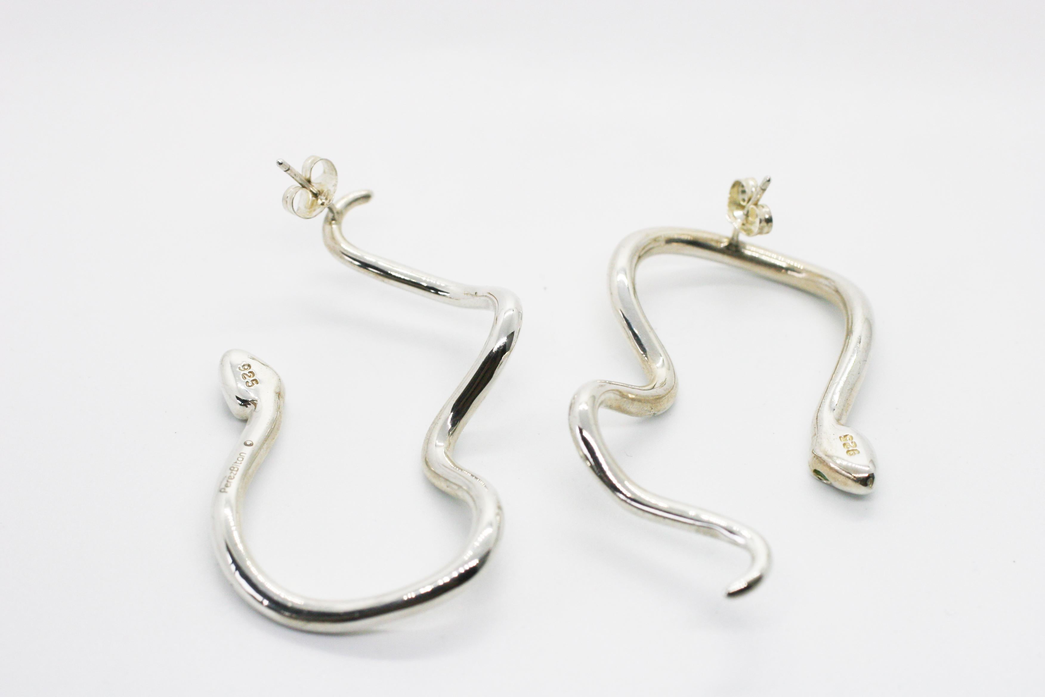 Large Sterling Sliver Signature Snake Hoops feature two oversize curved snakes that frame the face in alternating directions with green tsavorite eyes
Includes Sterling Silver push closure earring backings
Sold as a Pair