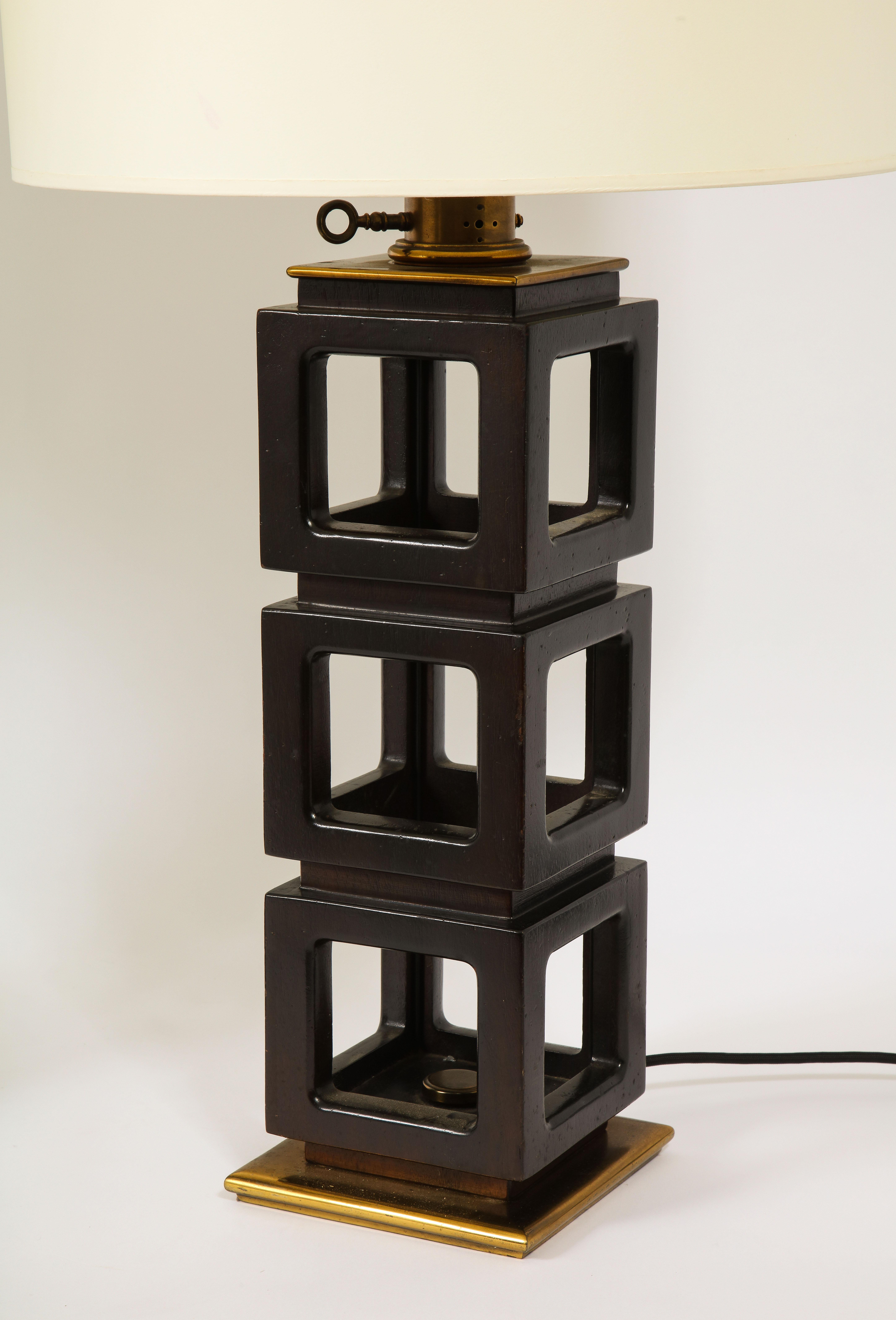 Imposing pair of stacked walnut and brass lamps by Stiffel.

Shades not included.