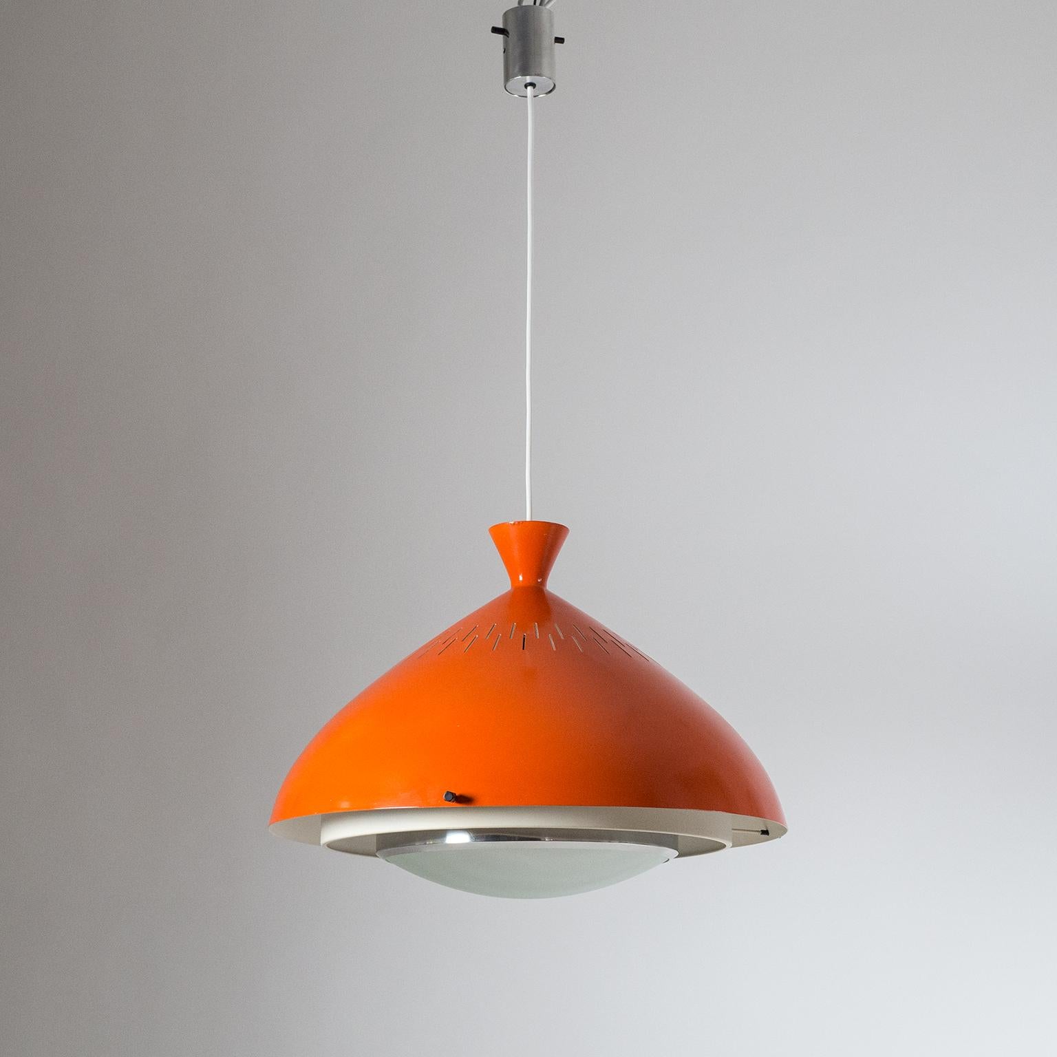 Very rare Stilnovo pendant from the late 1950s. The oversize aluminum shade is lacquered in a strong dark orange on the outside and off-white on the inside. Underneath is a tiered structure of white lacquered and polished aluminum rims with a curved