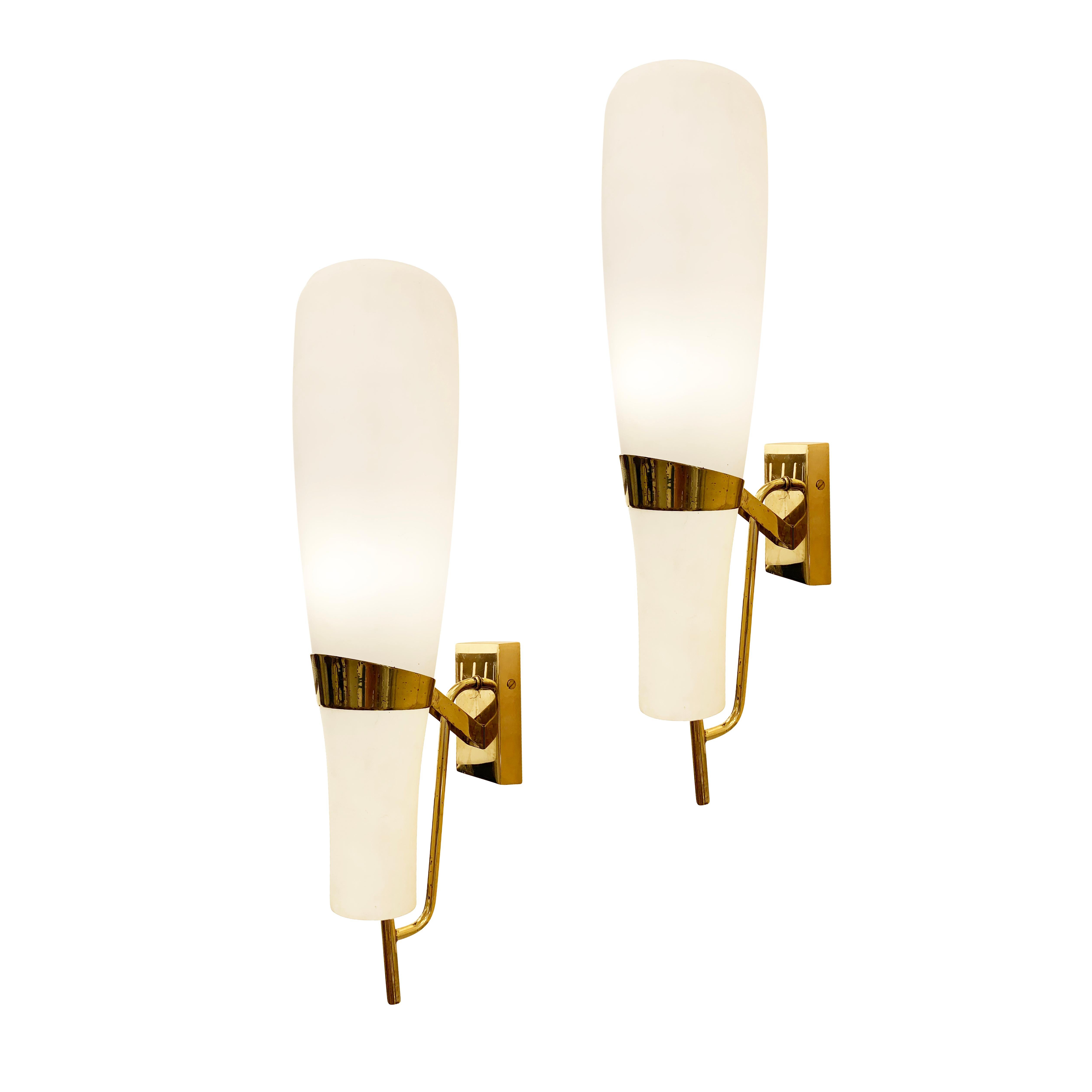 Large Italian Mid-Century sconces by Stilnovo with frosted glass shades and brass hardware. Each holds one E26 socket. Price per pair- 2 pairs available.

Condition: Excellent vintage condition, minor wear consistent with age and use.

Width: