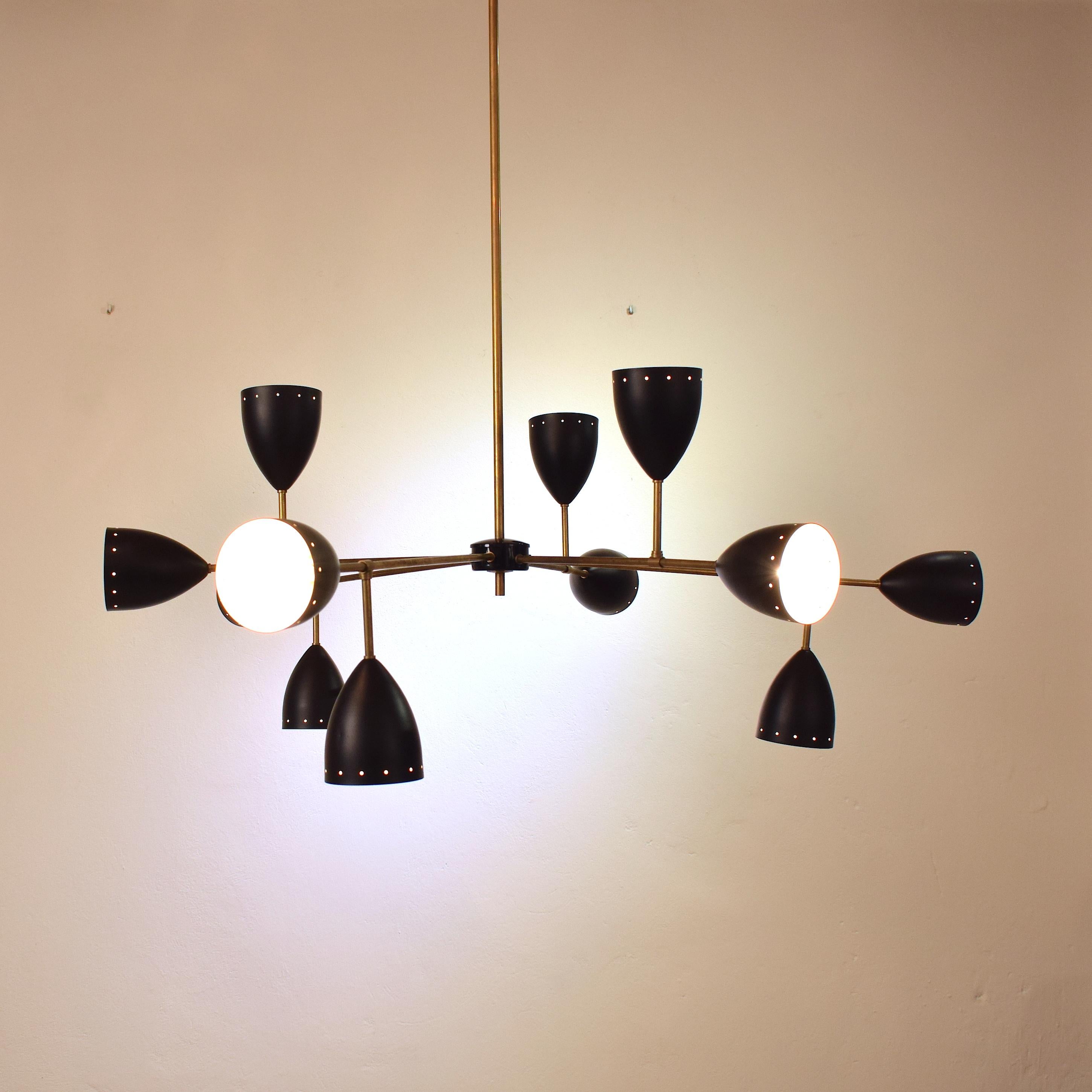 This large Stilnovo style chandelier is very extraordinary. The large scale-brass and black metal lamp shades are going in different directions.
It is crafted in Italy in the style of Stilnove from the 1950s.

The chandelier also works in the US.

A