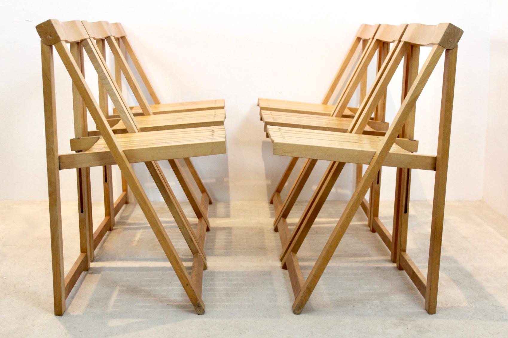 Comfortable folding chairs designed by Aldo Jacober for Alberto Bazzani. We have 40 pieces available. The chairs are made of Beechwood and have a very solid frame and a great sit. All in good condition with some user marks and beautiful patina