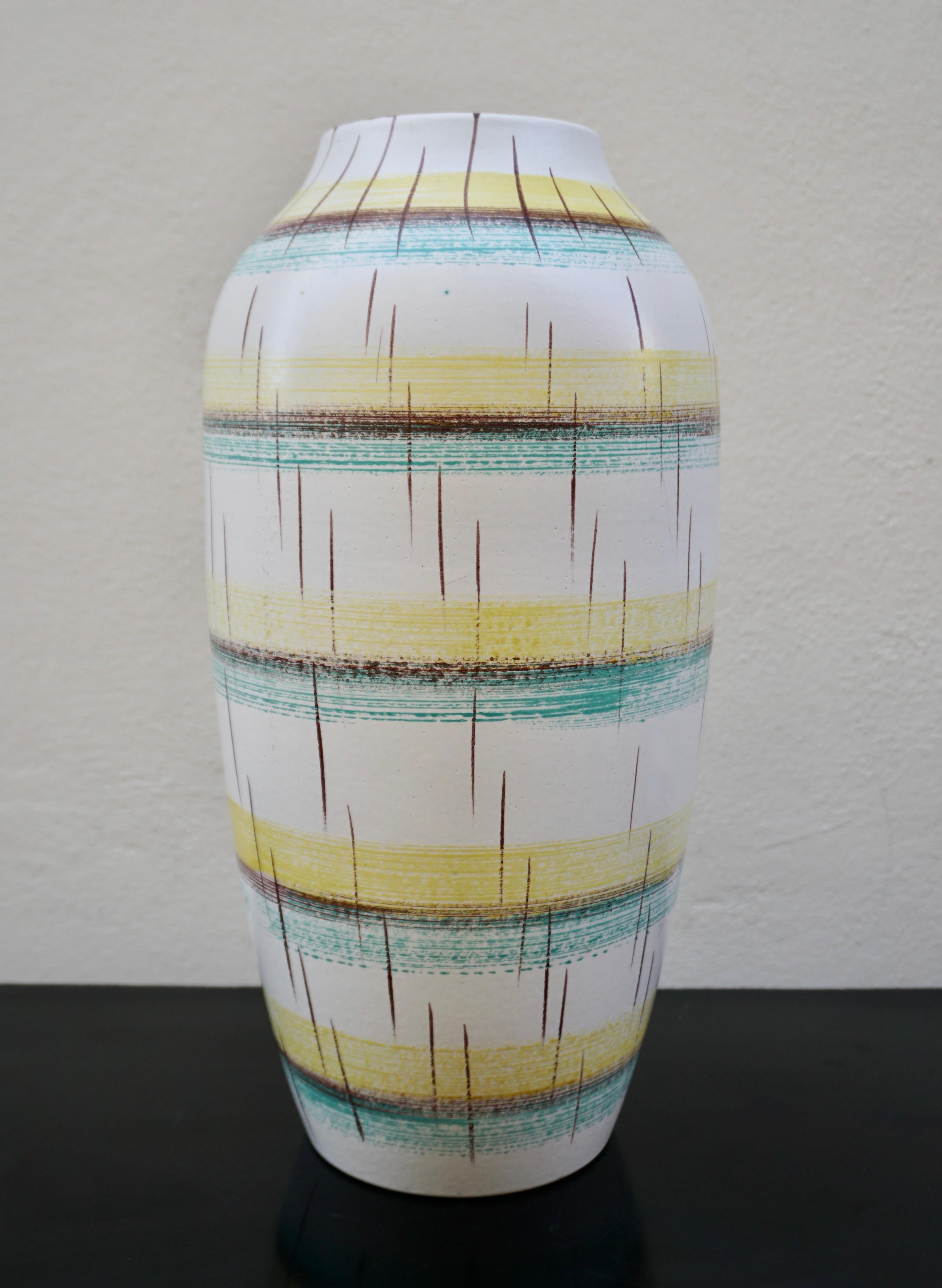 Large ceramic stoneware glazed decorative vase. 
Midcentury abstract design in blue, yellow, groen, black and creme. Germany, 1960s. Perfect condition. Measures: 
Diameter 9
