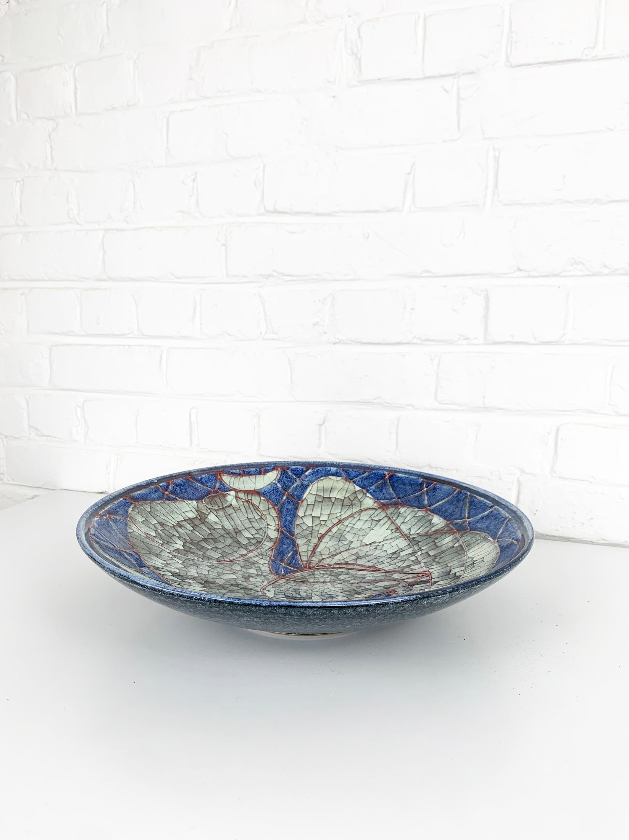 Scandinavian Bowl / Centerpiece in “Persia Technique” (crackle finish). It could also be hung on the wall. 

The bowl features a Rooster motive. Design Marianne Starck for Michael Andersen & Son, Denmark 1960s.

The Persia technique is a special