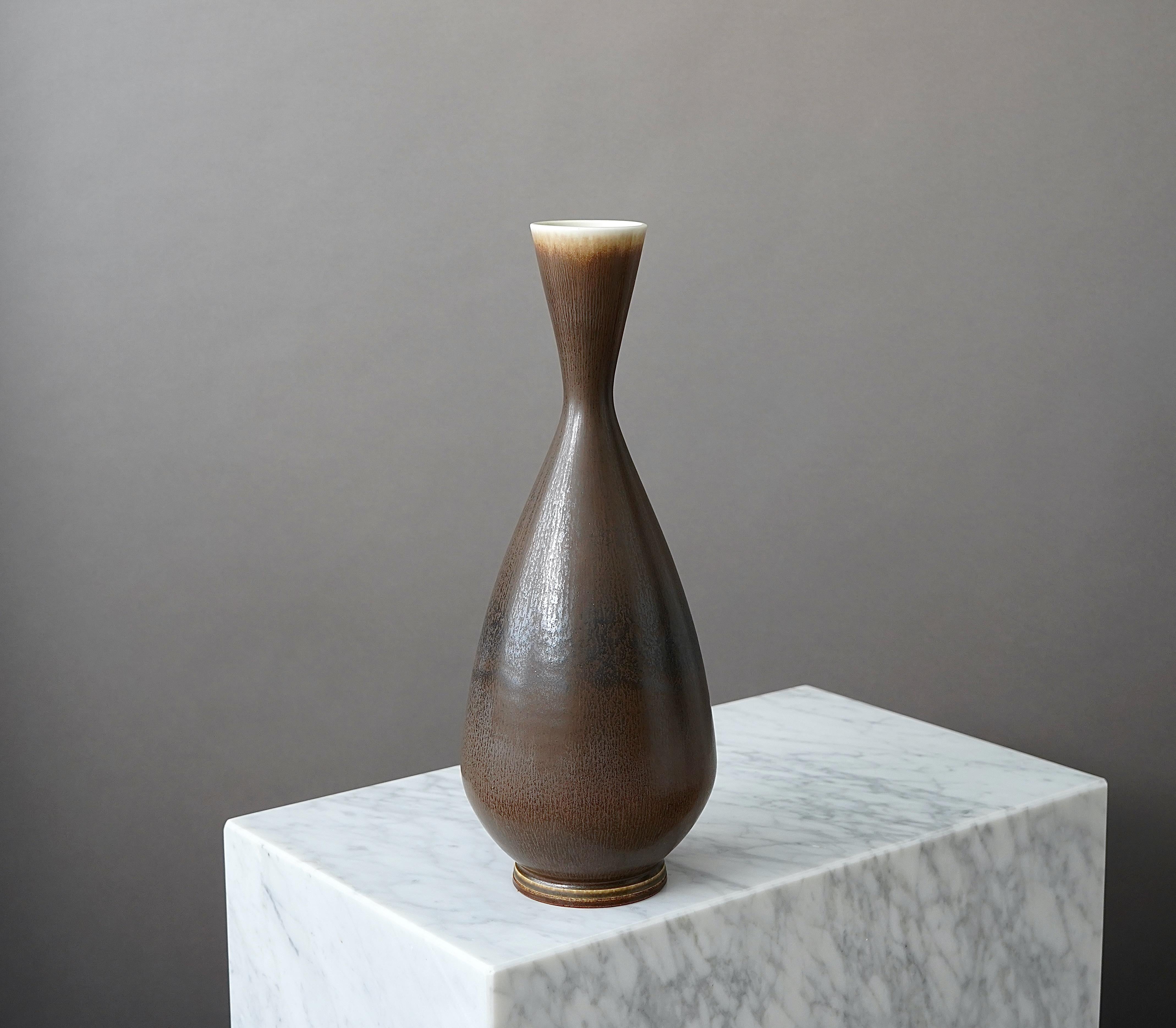 A large and beautiful stoneware vase with amazing hare’s fur glaze.
Made by master thrower Berndt Friberg, in the artist's studio at Gustavsberg, Sweden, 1963.

Great condition. 
Incised signature 