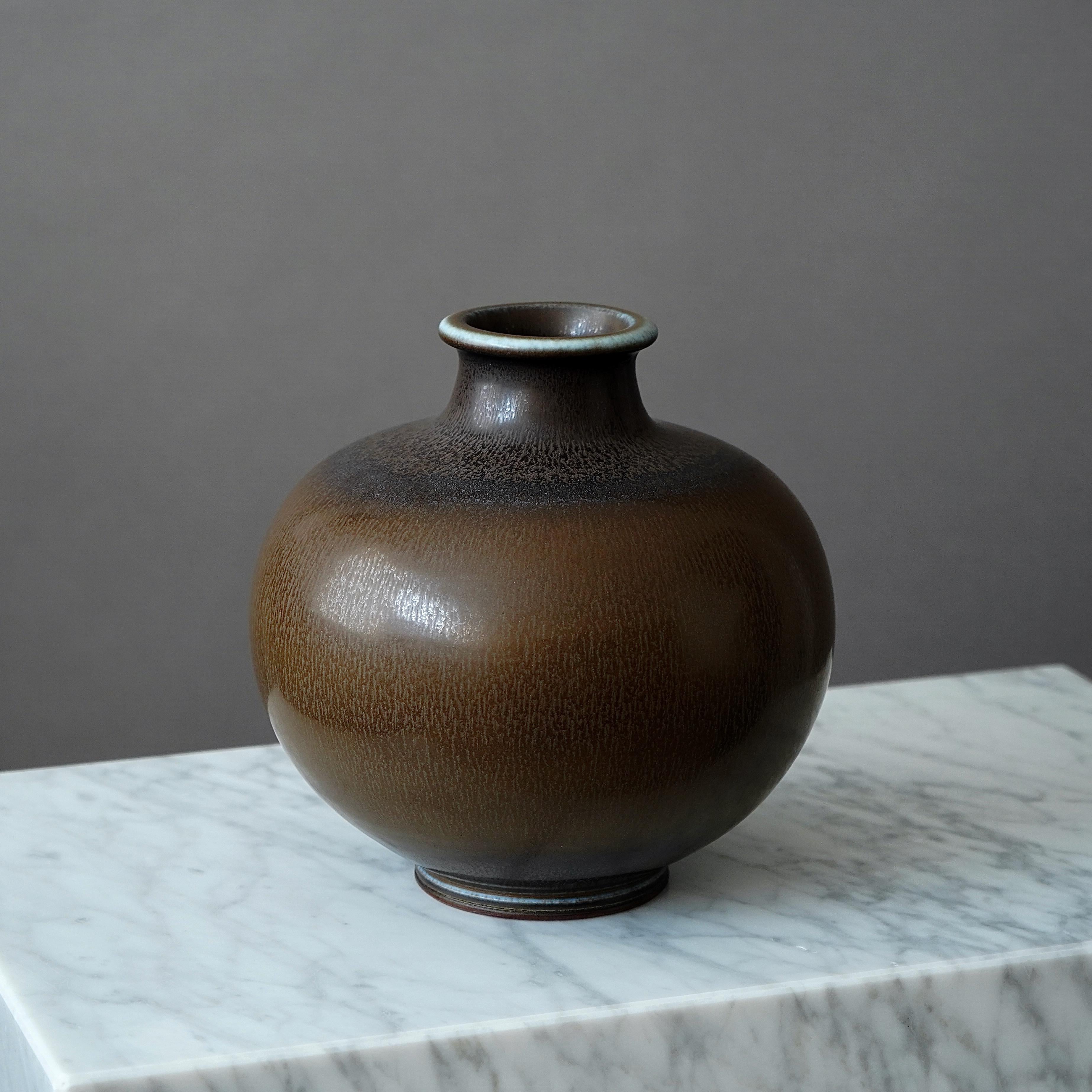 A large and beautiful stoneware vase with amazing hare’s fur glaze.
Made by master thrower Berndt Friberg, in the artist's studio at Gustavsberg, Sweden, 1963.

Excellent condition. 
Incised signature 