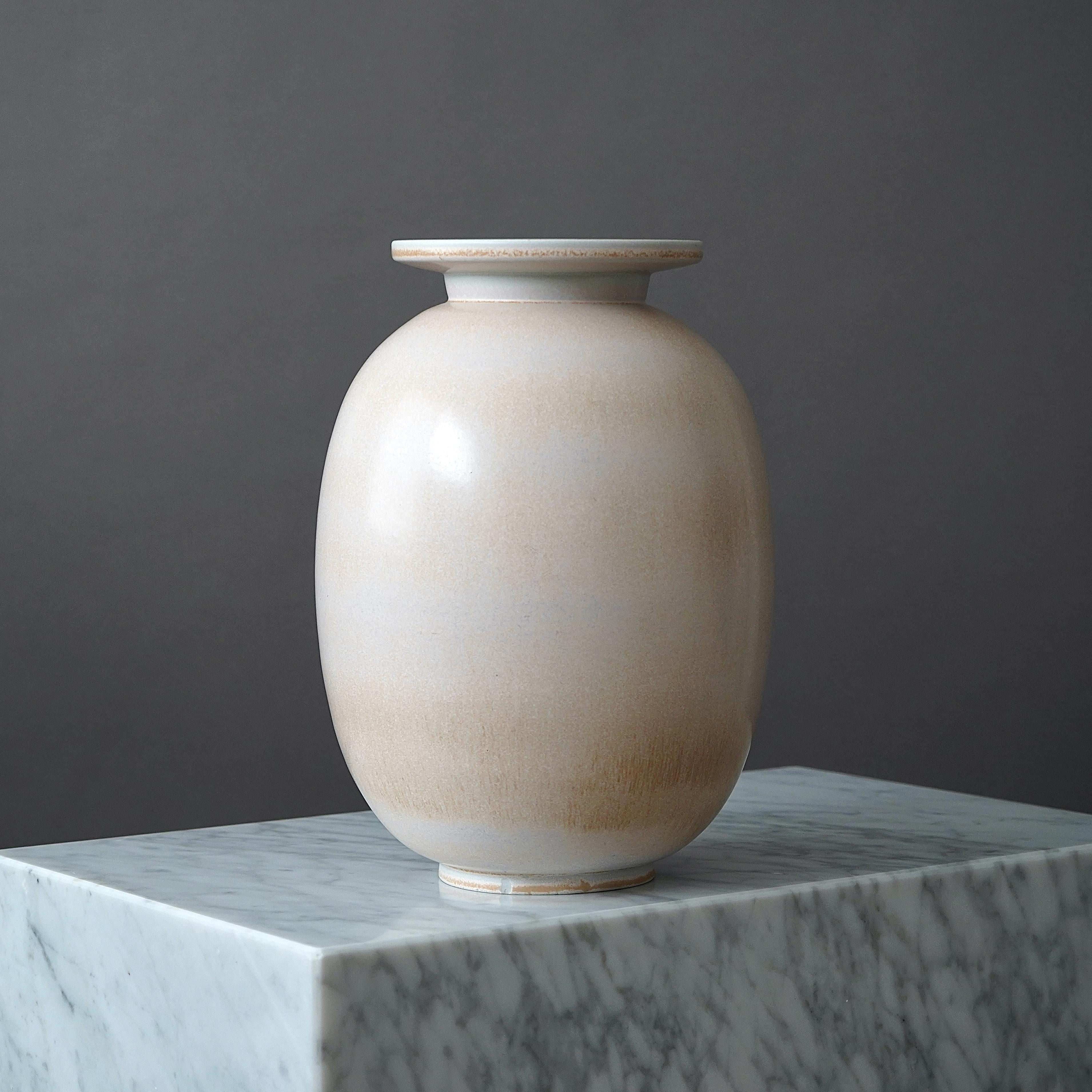 A large beautiful stoneware vase with amazing and rare glaze. 
Designed by Gunnar Nylund for Rorstrand, Sweden, 1940s.  

Incised signature 