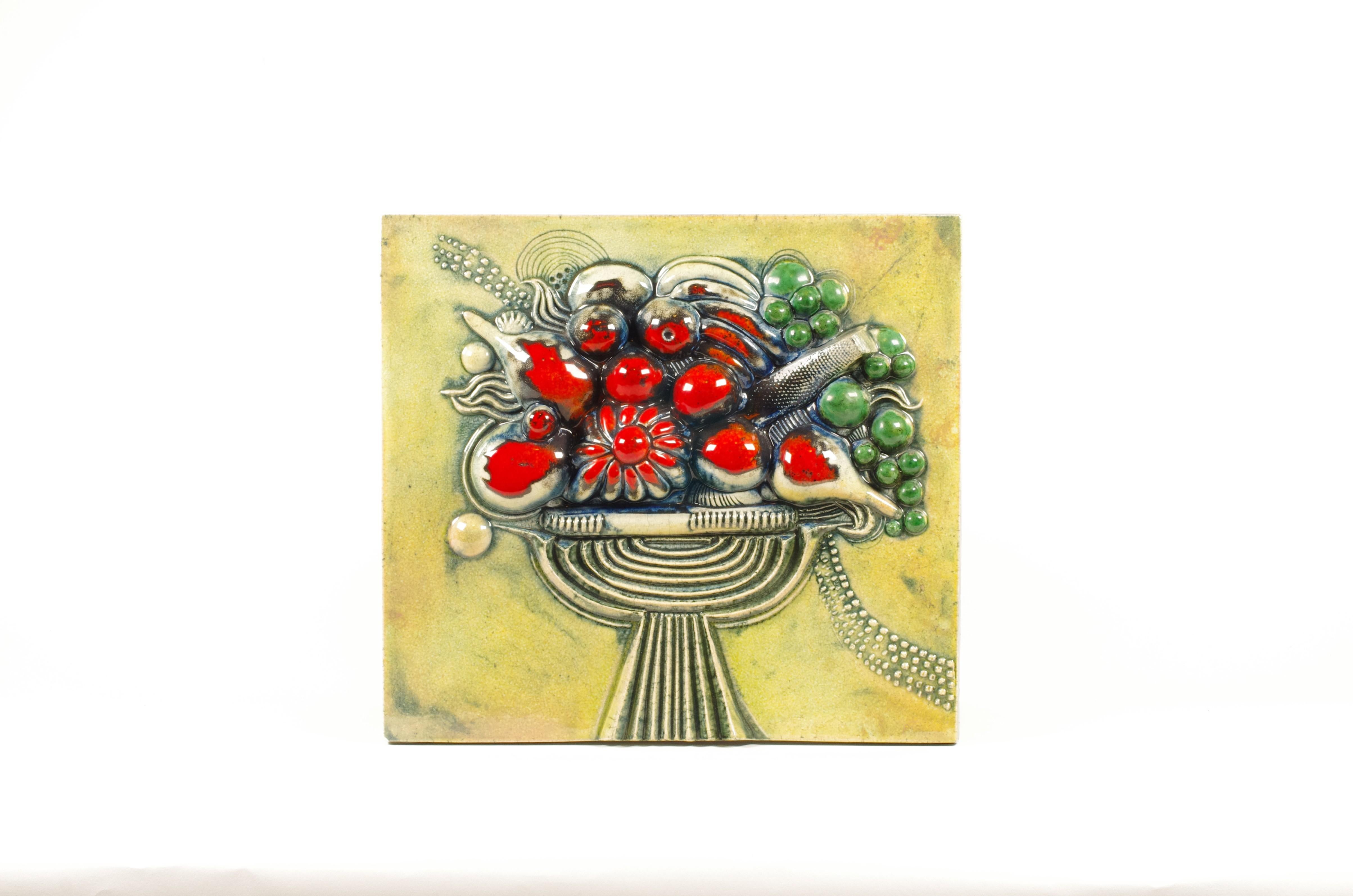 Large and richly modelled stoneware wall relief (väggrelief) by Bertil Vallien, produced by Gustavsberg, Sweden, in the 1960s. Executed in high-fired stoneware with a sculptural fruit still-life arranged in a pedestal bowl, the piece combines