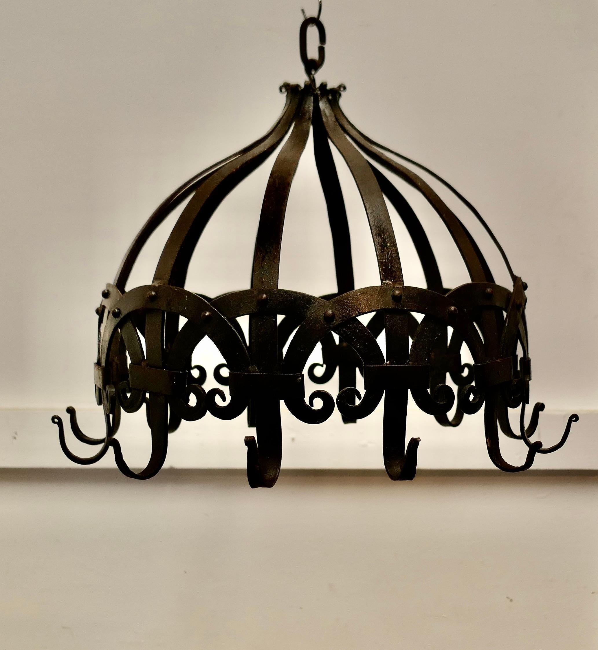Large Strapwork Blacksmith Made Iron Game Hanger, Kitchen Utensils or Pot Hanger

A great old piece with lots of Character, if you don’t need it to hang your game on how about your pots or kitchen utensils, the hanger is circular with 12 hooks