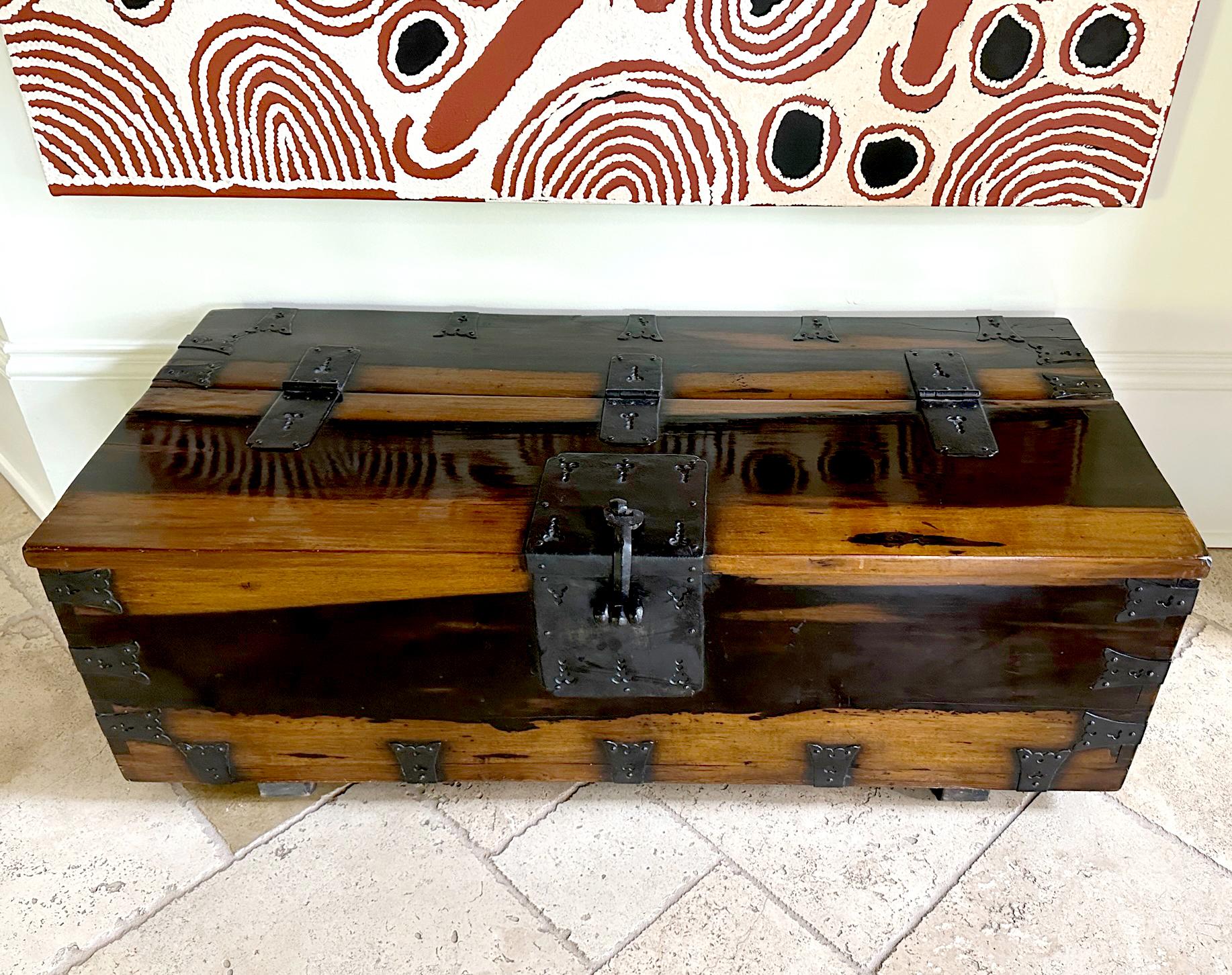A large Korean top-lid chest on block feet circa late 19th century Joseon Dynasty. Known as coin chest (Ton-Kwe in Korean), this type of chest was originally used for storing money. The larger versions were probably used to store other valuables.